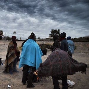 Honduran migrants warm themselves next to a campfire near the train tracks in the community of Caborca in Sonora state, Mexico, on January 13, 2017.
Hundreds of Central American and Mexican migrants attempt to cross the US border daily. (Alfredo Estrella/AFP/Getty Images)