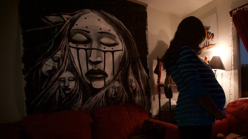 Jen, who wants to remain anonymous, is a pregnant mother who is not reporting the baby to the authorities for fear of having the child taken away. (Photograph by John Woods)
