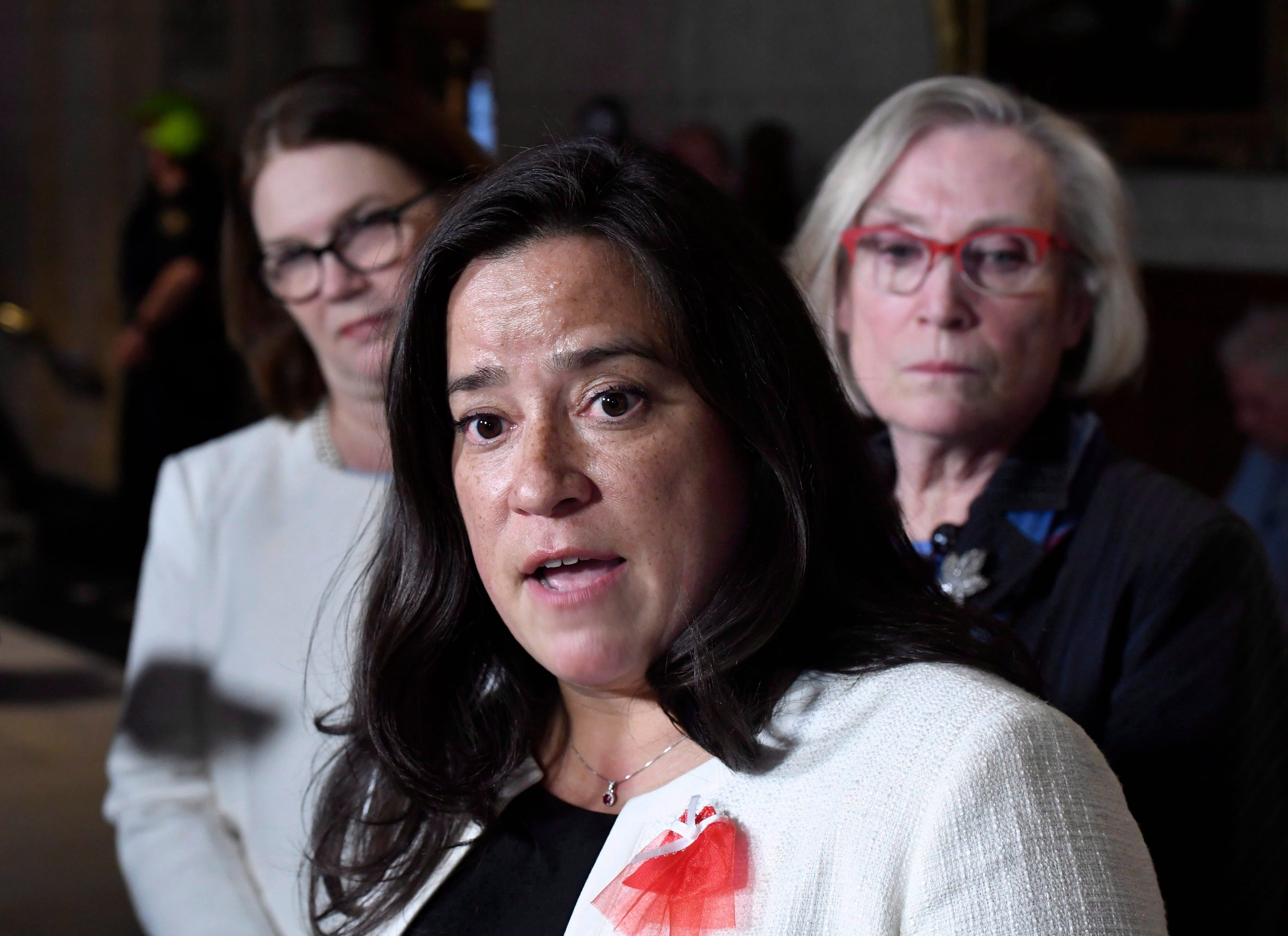 Wilson-Raybould, when she was justice minister, speaks to reporters as then-minister of Indigenous services Jane Philpott and minister of Crown-Indigenous relations Carolyn Bennett look onTHE CANADIAN PRESS/Justin Tang