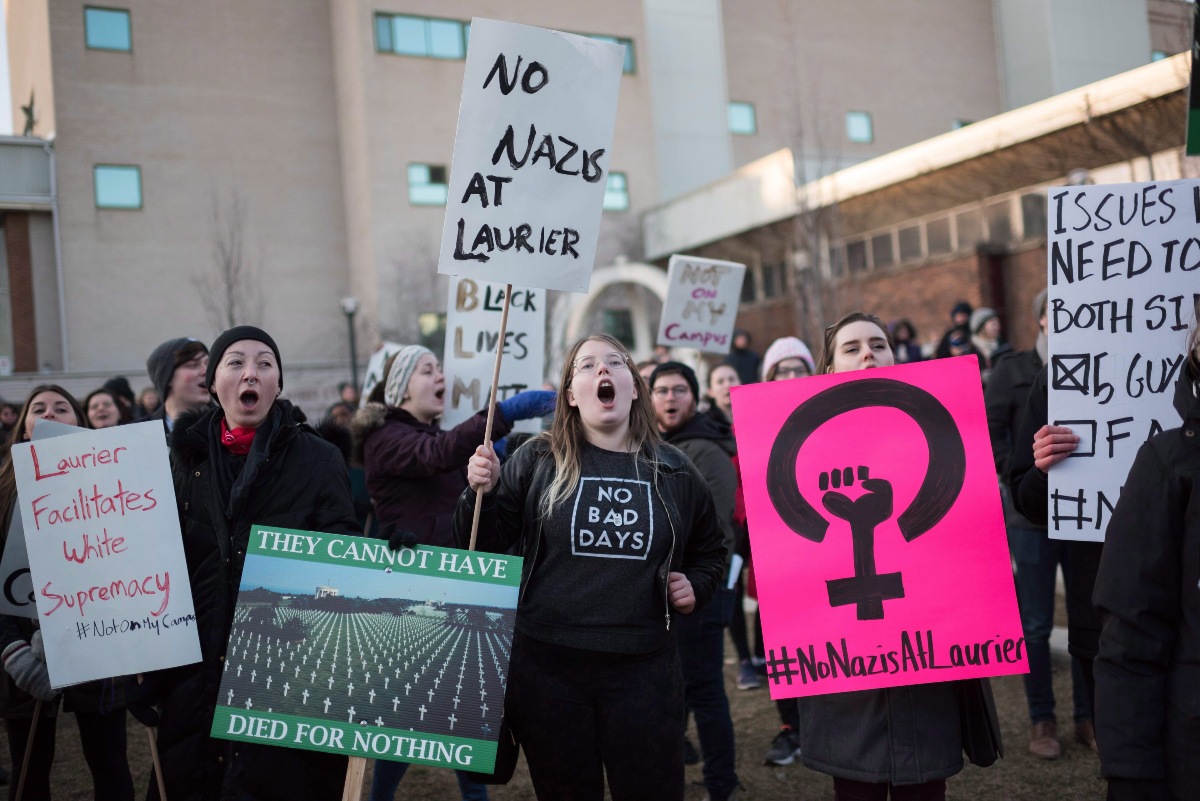 Students participate in protests against Faith Goldy, who was at Wilfrid Laurier University to speak in Waterloo on Tuesday, March 20, 2018. (THE CANADIAN PRESS/Hannah Yoon)