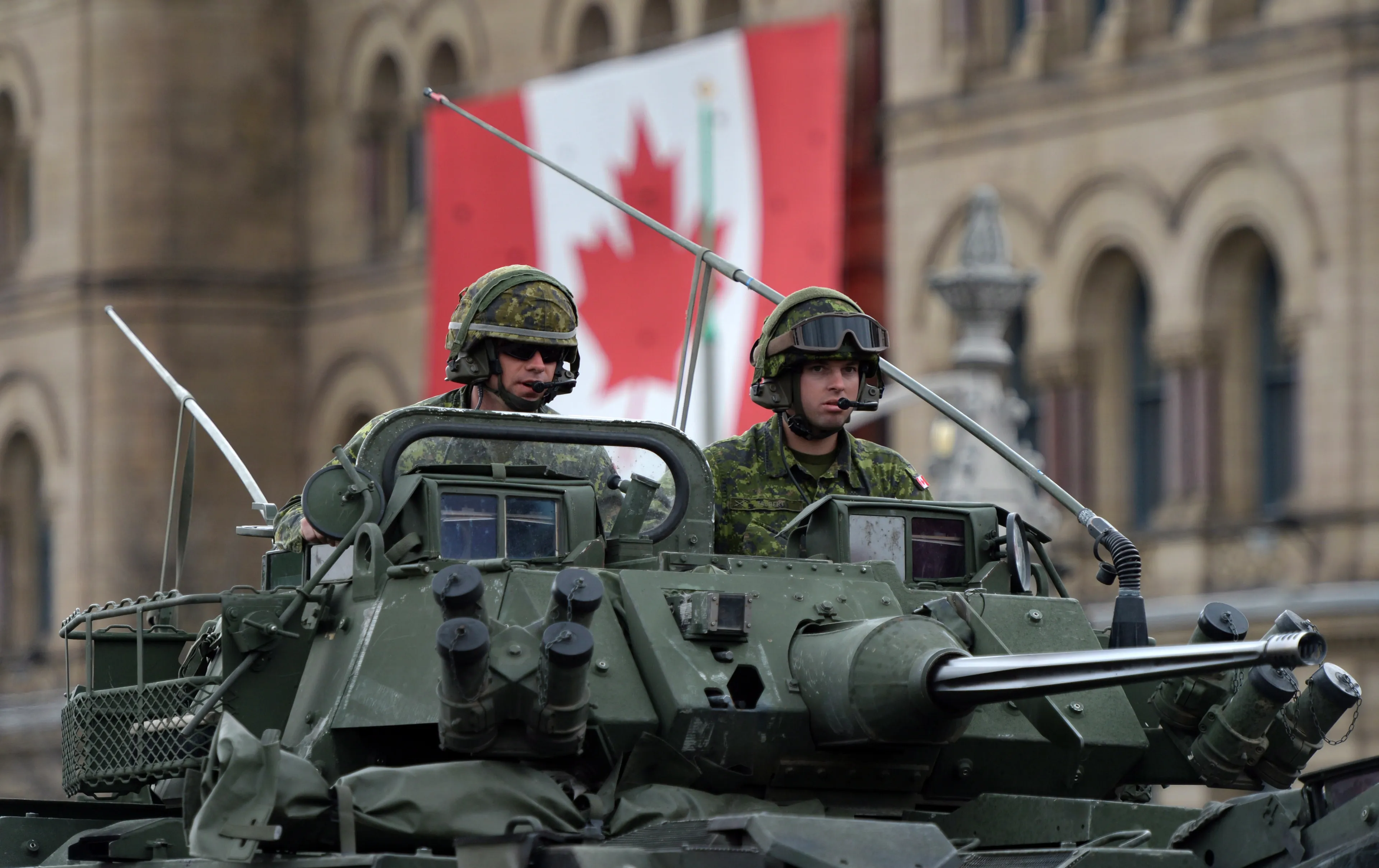 Canadian Forces members drive a LAV onto Parliament Hill during the National Day of Honour in Ottawa on Friday, May 9, 2014. THE CANADIAN PRESS/Sean Kilpatrick