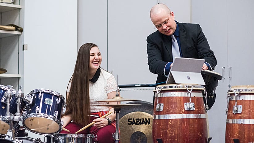 Grade 12 student Theresa Henderson meets with Kwantlen professor David Burns. (Jimmy Jeong)