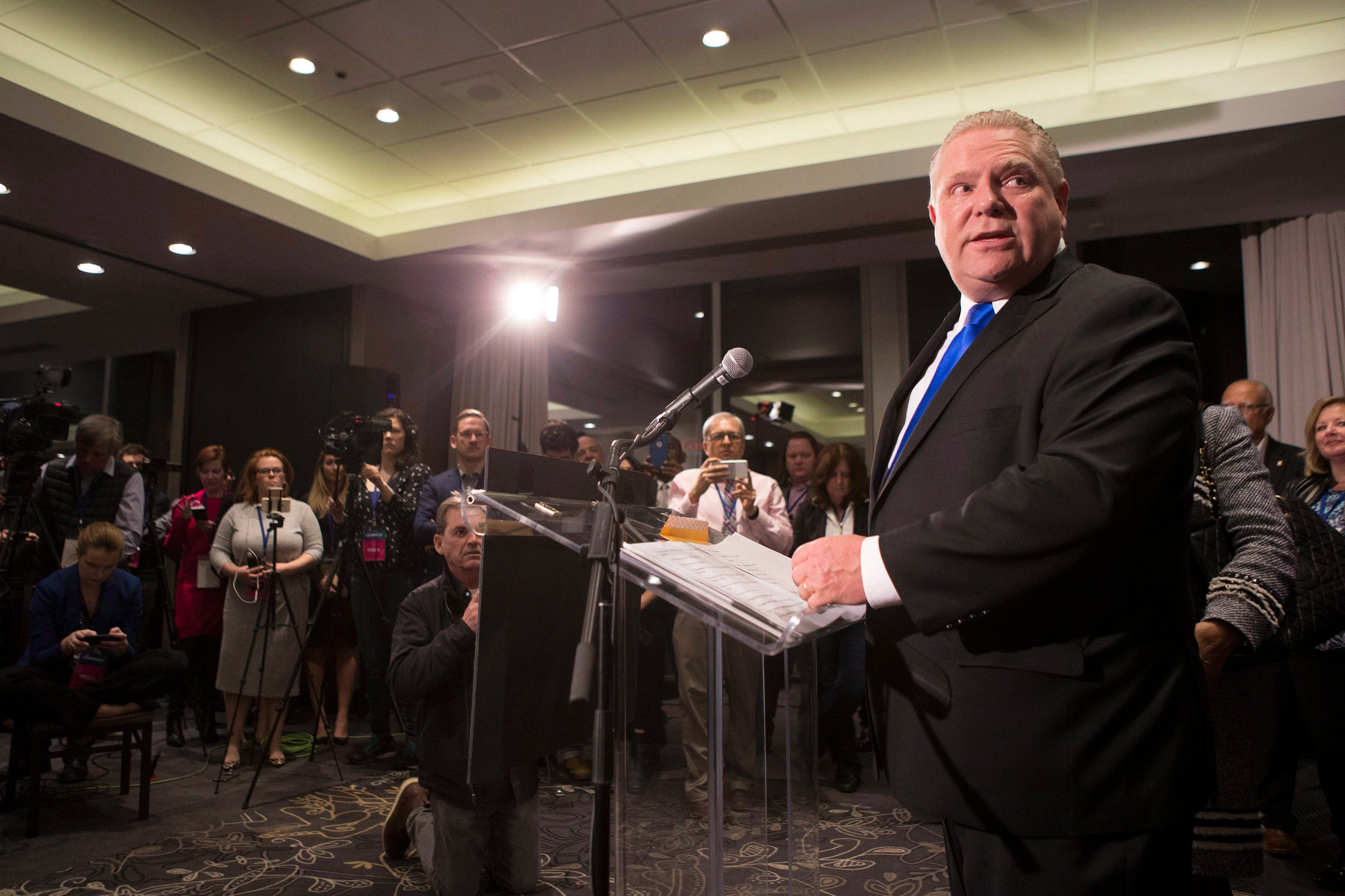 Doug Ford stands at the podium after being named as the newly elected leader of the Ontario Progressive Conservatives at the delayed Ontario PC Leadership announcement in Markham, Ont., on Saturday, March 10, 2018. THE CANADIAN PRESS/Chris Young