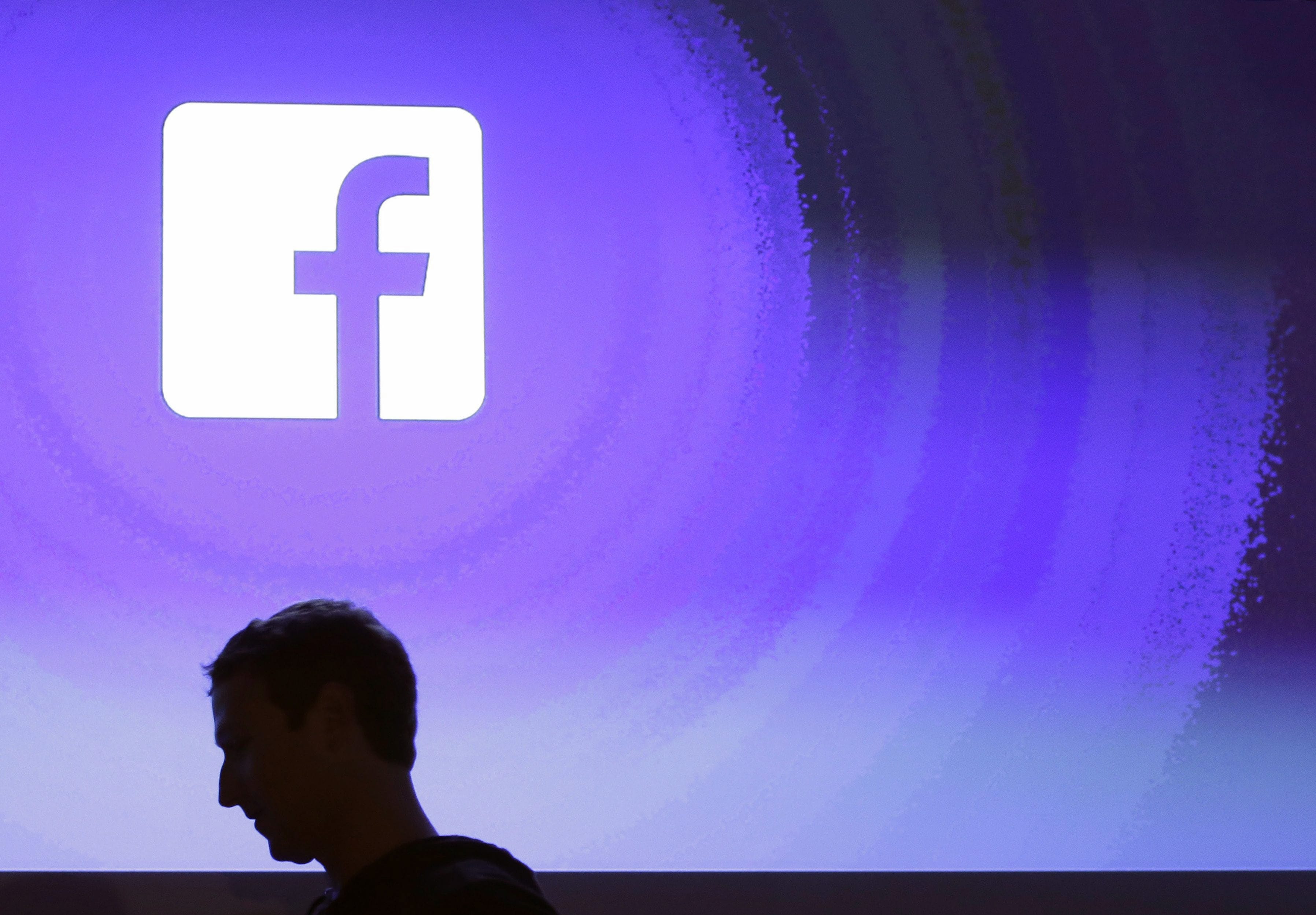 Facebook CEO Mark Zuckerberg walks at the company's headquarters in Menlo Park, Calif. (Marcio Jose Sanchez/AP)