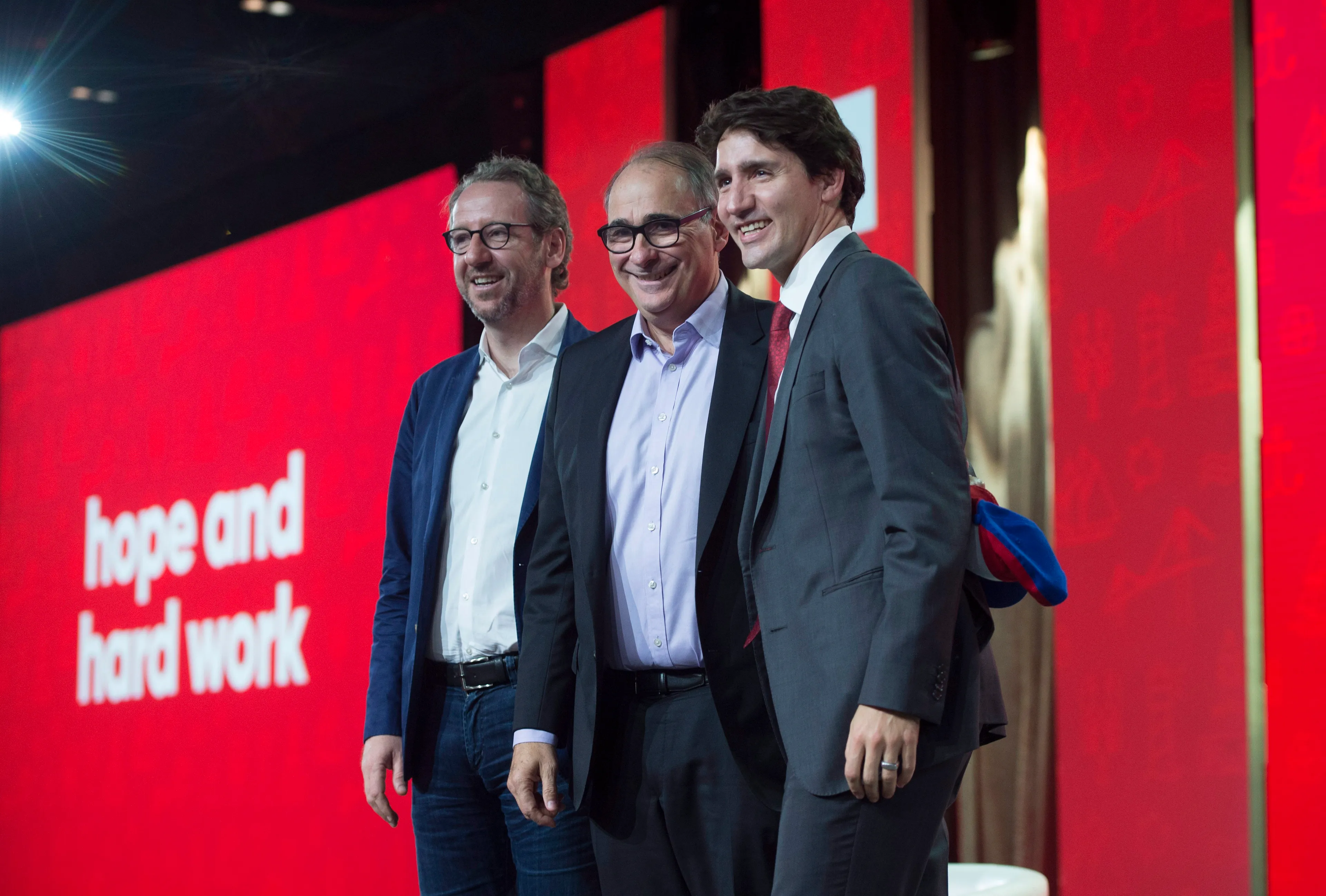 Prime Minister Justin Trudeau, right, poses with Gerald Butts, left, Trudeau's senior political adviser, and David Axelrod, Chief Strategist for Barack Obama's presidential campaign, at the federal Liberal national convention in Halifax on Friday, April 20, 2018. (THE CANADIAN PRESS/Darren Calabrese)