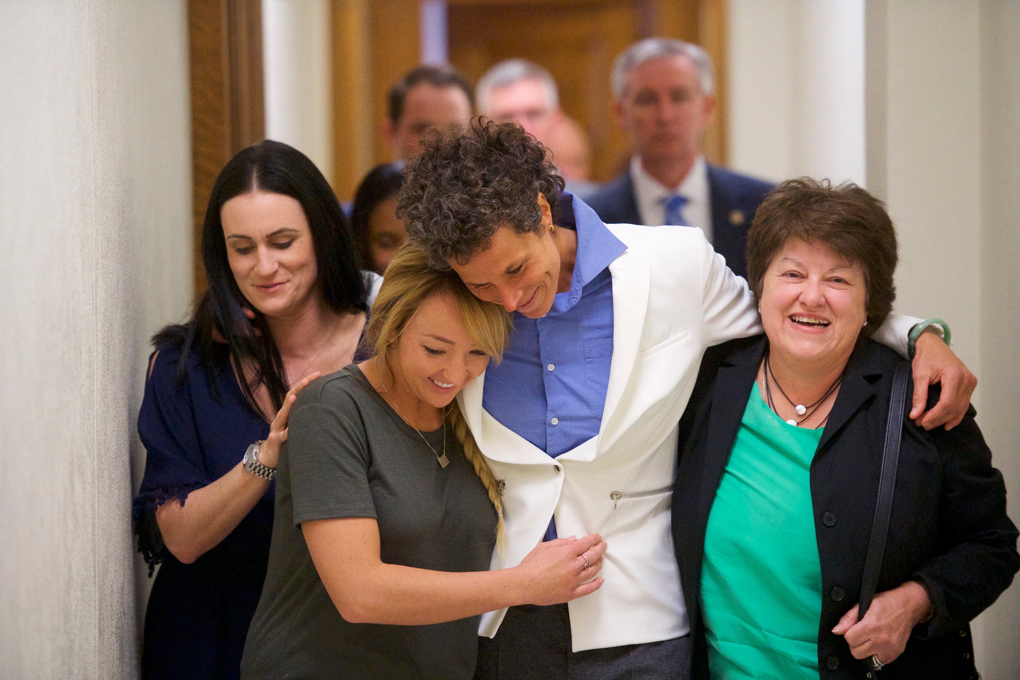 Bill Cosby accuser Andrea Constand (C) reacts with lawyer Dolores Troiani (R) and Delaney Henderson (L) after the guilty on all counts verdict was delivered in the sexual assault retrial at the Montgomery County Courthouse on April 26, 2018 in Norristown, Pennsylvania (Mark Makela/Getty Images)