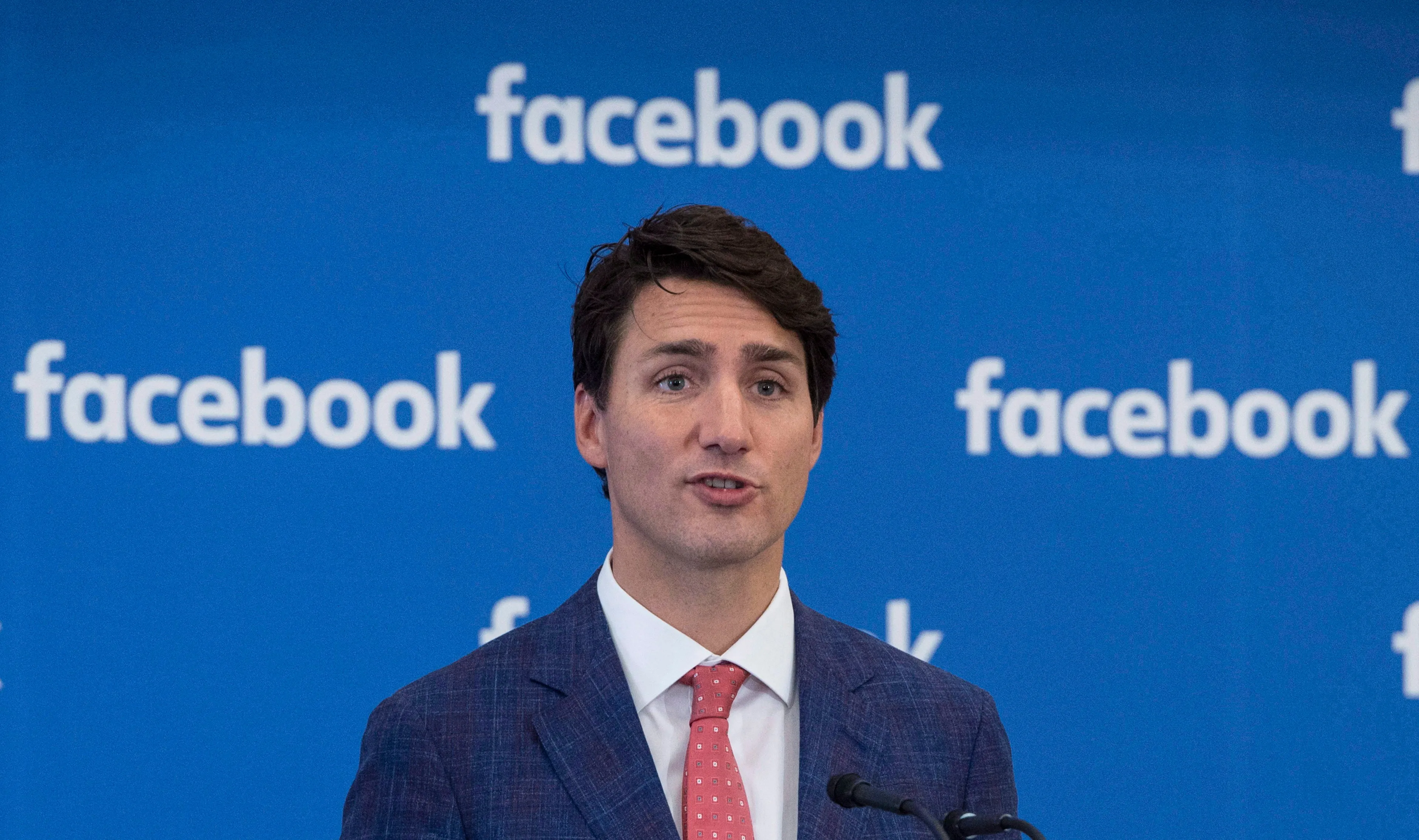Prime Minister Justin Trudeau addresses the audience during the Facebook launching of an artificial intelligence research lab Sept. 15, 2017 in Montreal. (Paul Chiasson/The Canadian Press)