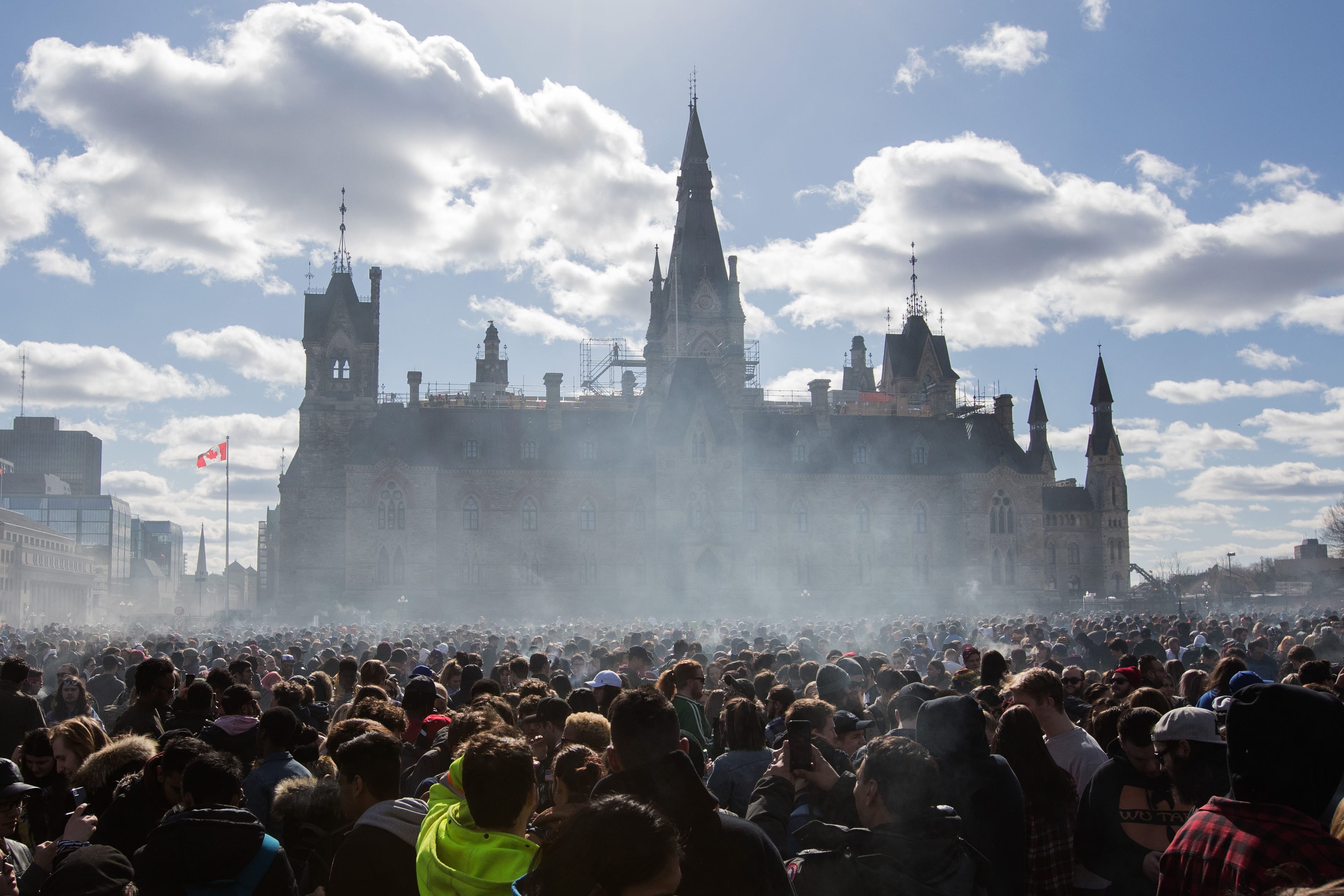 Smoke lingers over Parliament Hill as people smoke marijuana during the annual 4/20 rally on Parliament Hill in Ottawa, Ontario on April 20, 2018. (Lars Hagberg/AFP/Getty Images)