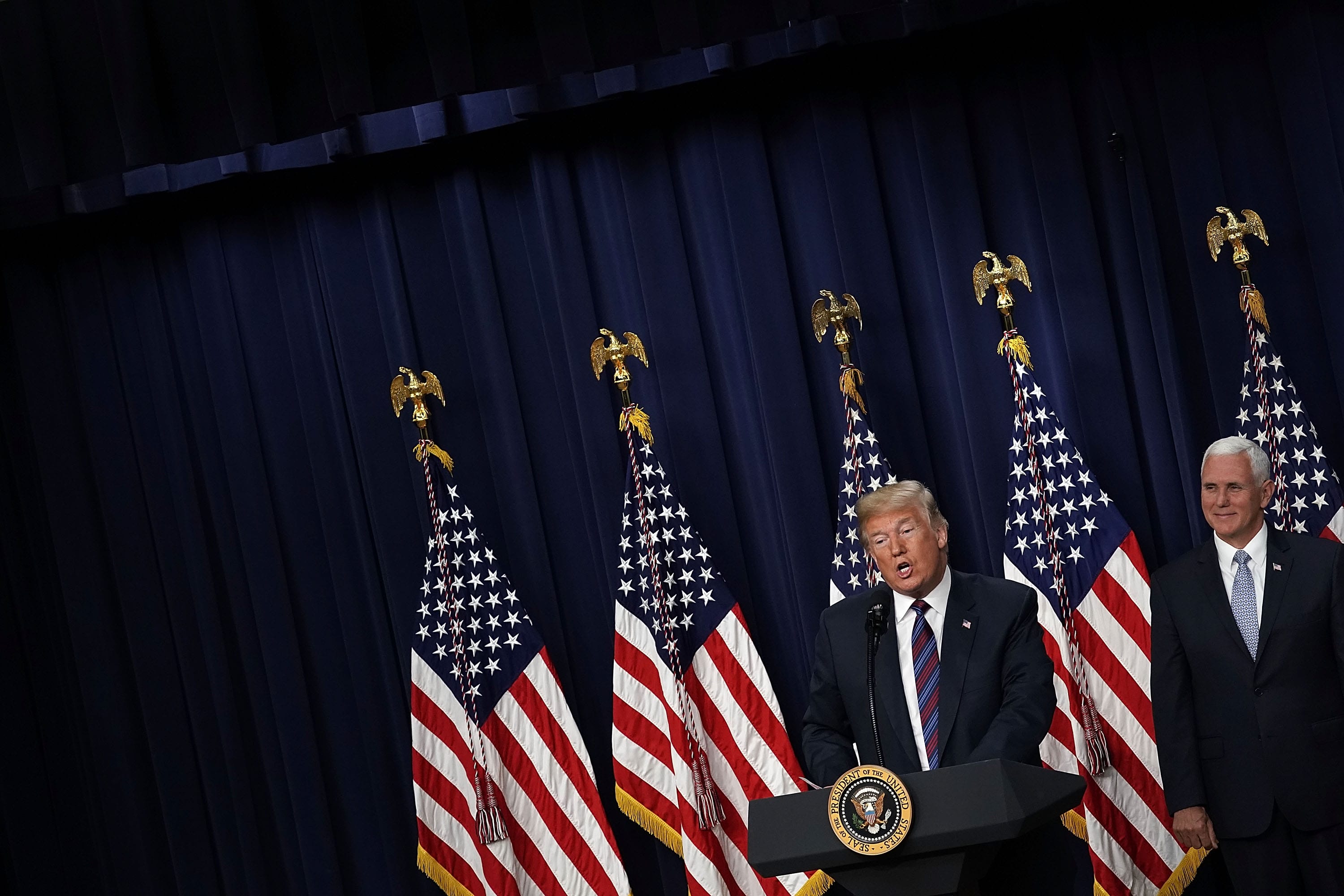 WASHINGTON, DC - MAY 30: U.S. President Donald Trump (L) speaks as Vice President Mike Pence (R) looks on during a bill signing ceremony at the South Court Auditorium of the Eisenhower Executive Building May 30, 2018 in Washington, DC. President Trump has signed S. 204, the 'Right to Try Act' into law. (Photo by Alex Wong/Getty Images)