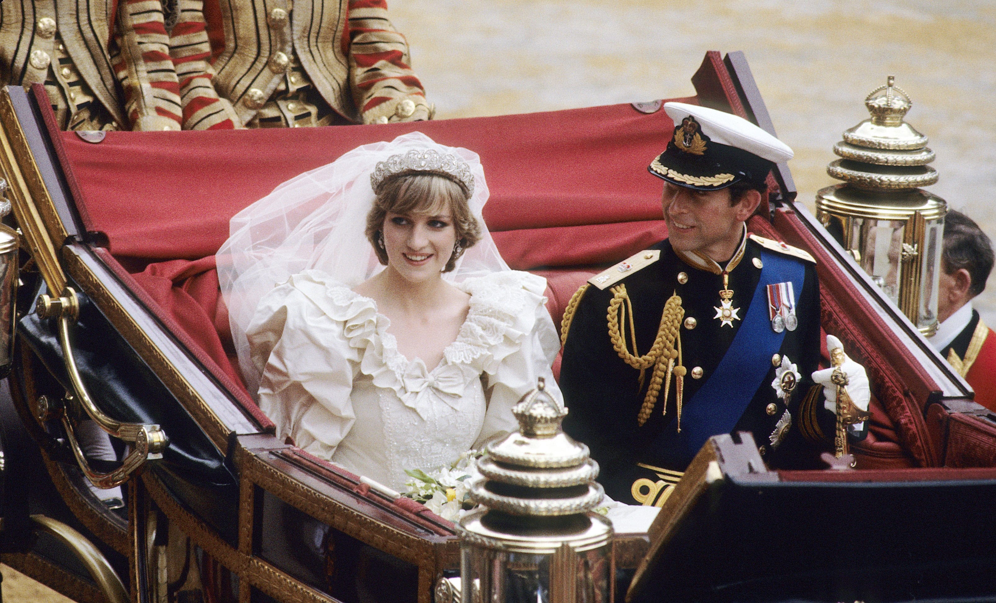LONDON - JULY 29: Diana, Princess of Wales and Prince Charles ride in a carriage after their wedding at St. Paul's Cathedral July 29, 1981 in London, England. (Photo by Anwar Hussein/WireImage)