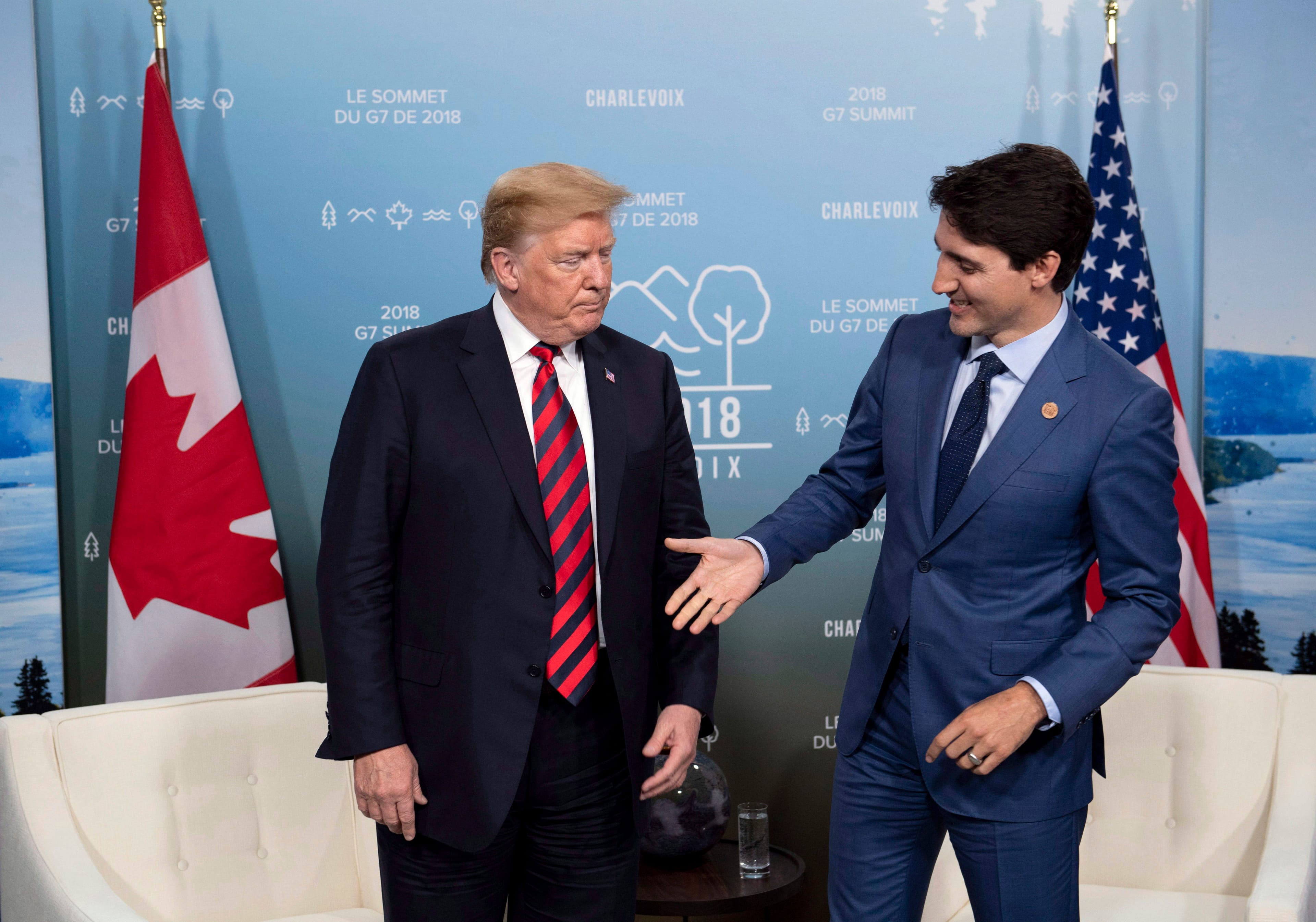 Canada's Prime Minister Justin Trudeau shakes hands with U.S. President Donald Trump during a meeting at the G7 leaders summit in La Malbaie, Quebec on Friday, June 8, 2018. THE CANADIAN PRESS/Justin Tang