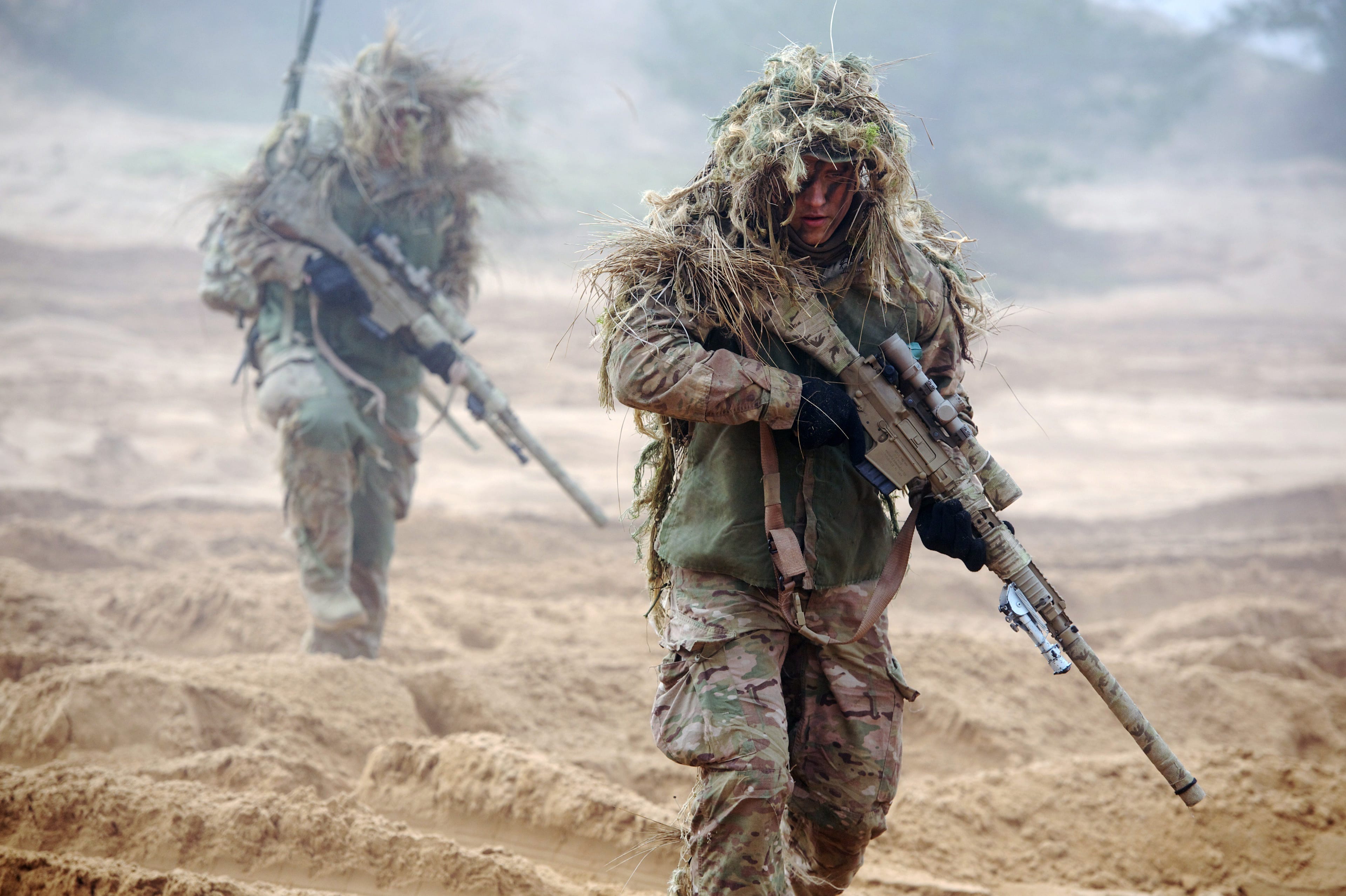 U.S. soldiers train with Latvian and Canadian soldiers at the Adazi military training area in Latvia on Feb. 26, 2015 (ILMARS ZNOTINS/AFP/Getty Images)