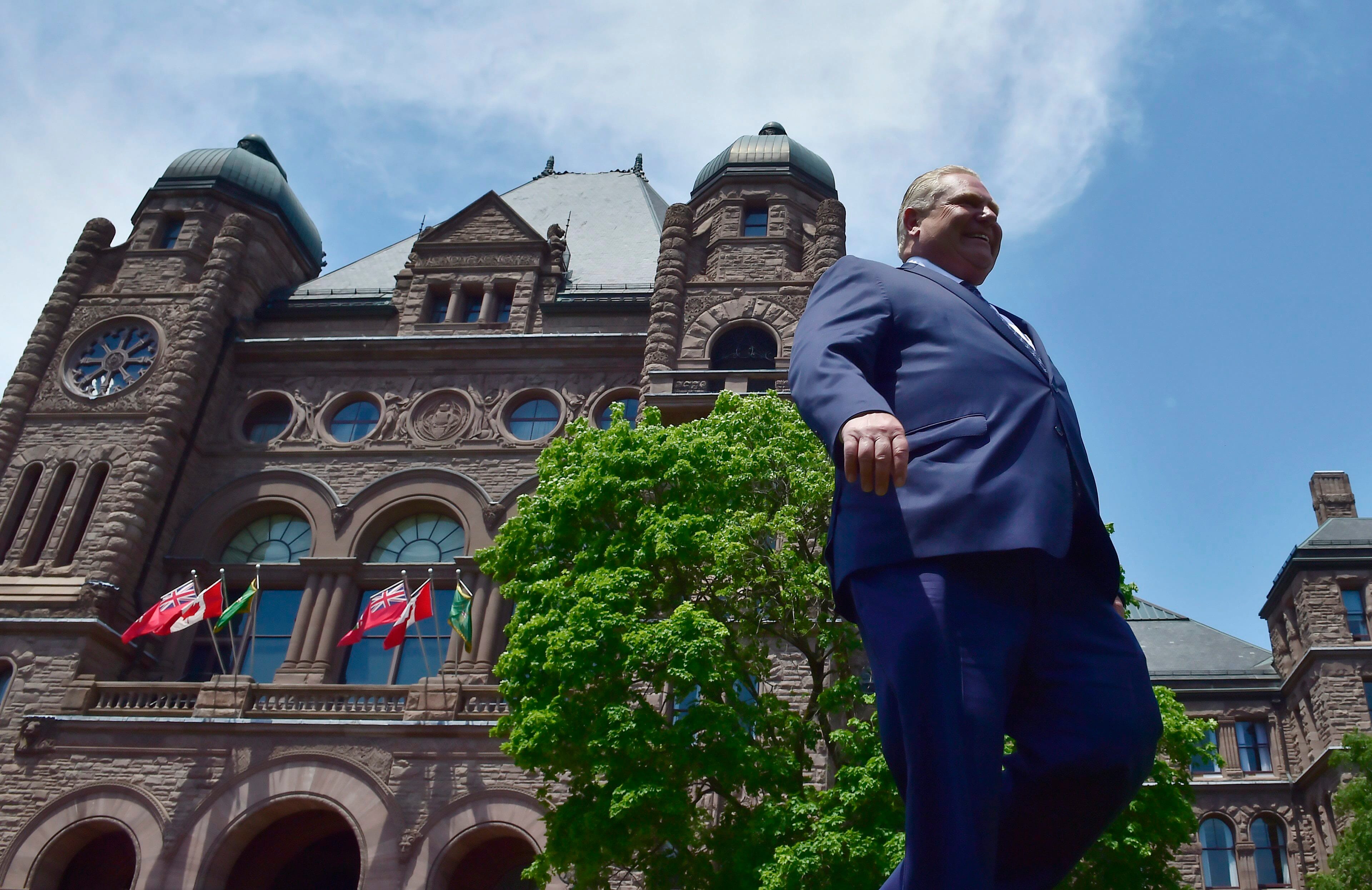 Ontario premier-designate Doug Ford walks out onto the front lawn of the Ontario Legislature at Queen's Park in Toronto on Friday, June 8, 2018. (Frank Gunn/CP)