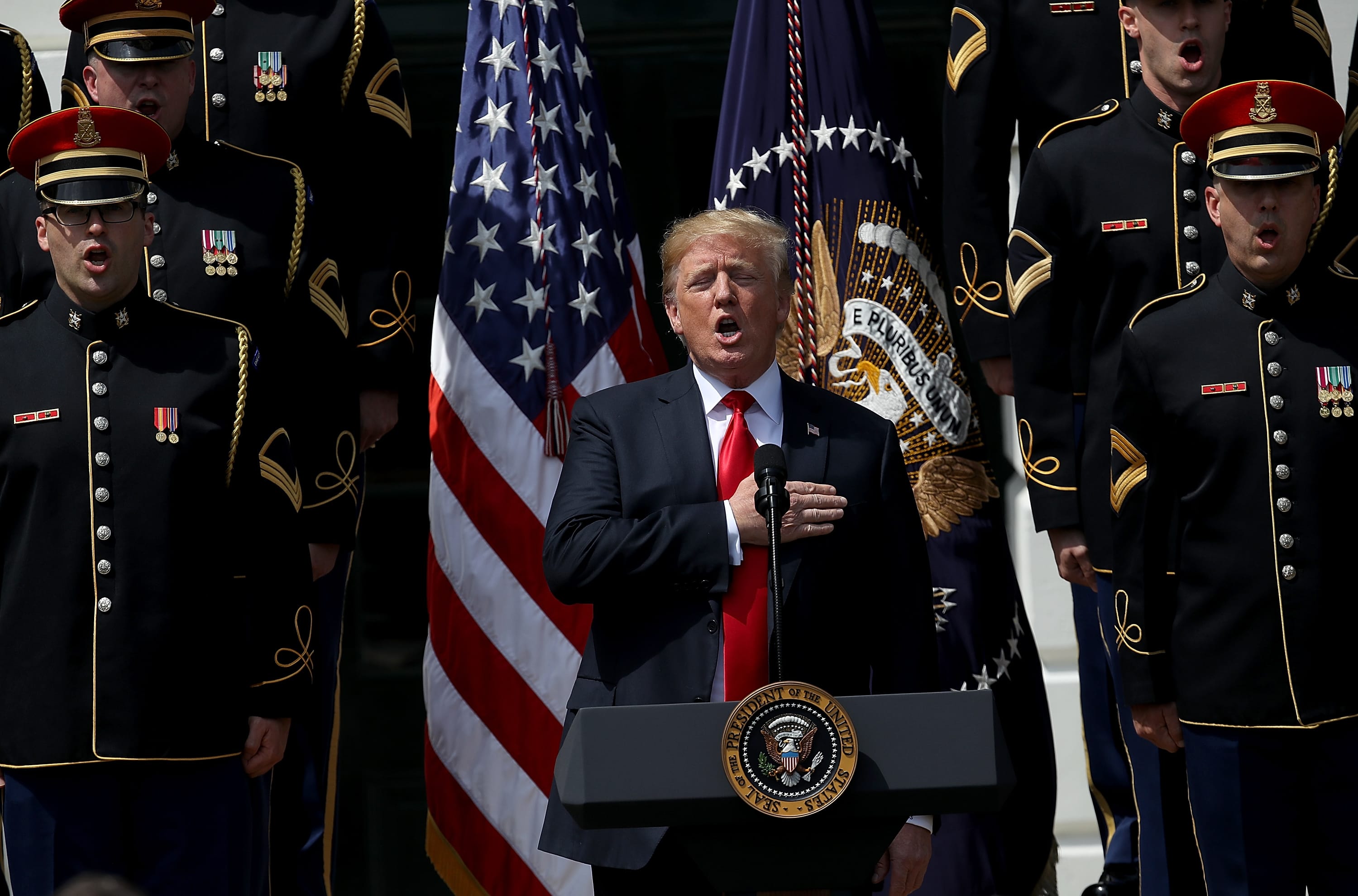 U.S. President Donald Trump sings the national anthem with a U.S. Army chorus during a "Celebration of America" event on the south lawn of the White House June 5, 2018 in Washington, DC. (Win McNamee/Getty Images)