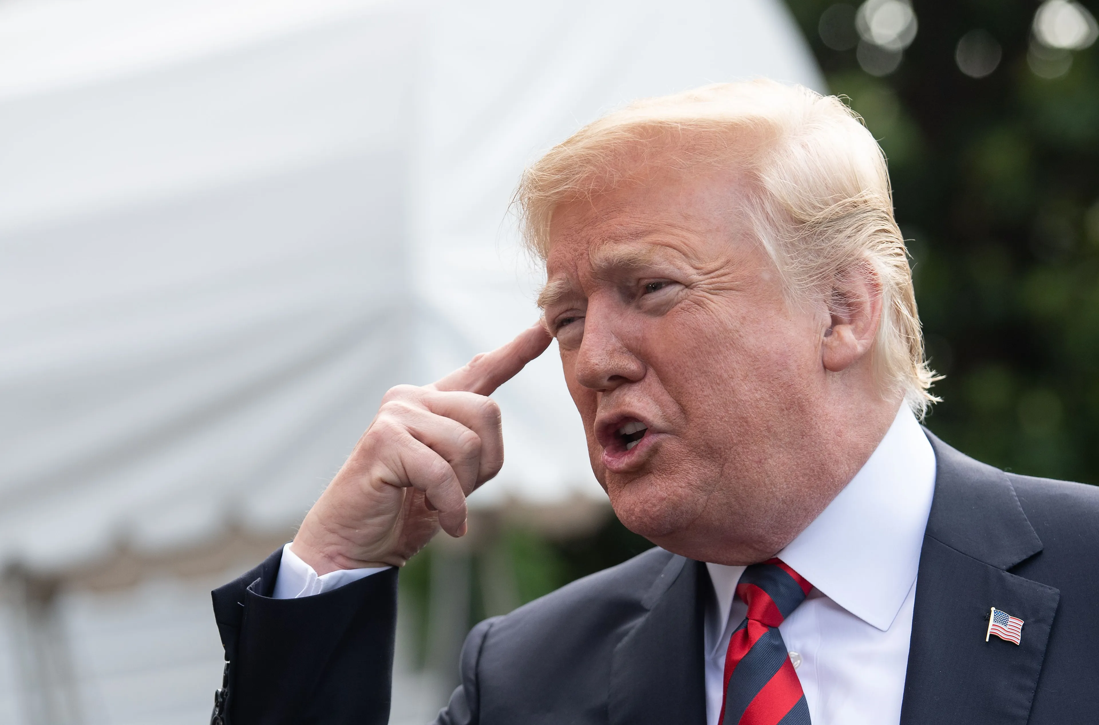 US President Donald Trump speaks to the press before departing the White House for the G7 summit in Washington, DC, on June 8, 2018. (Photo credit should read NICHOLAS KAMM/AFP/Getty Images)
