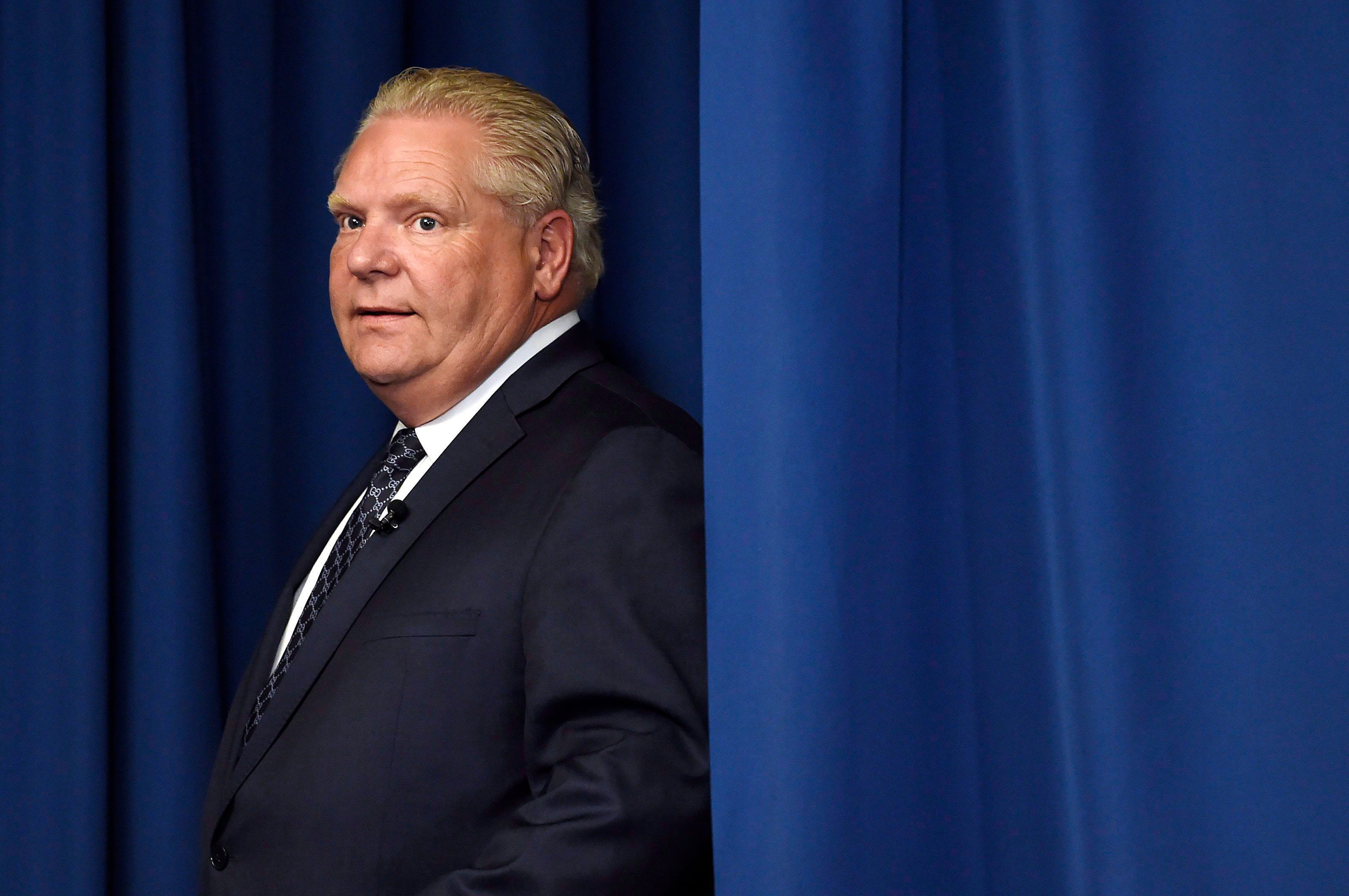 Ontario Progressive Conservative Leader Doug Ford arrives as he holds a press conference in Toronto on Thursday, May 10, 2018. THE CANADIAN PRESS/Nathan Denette