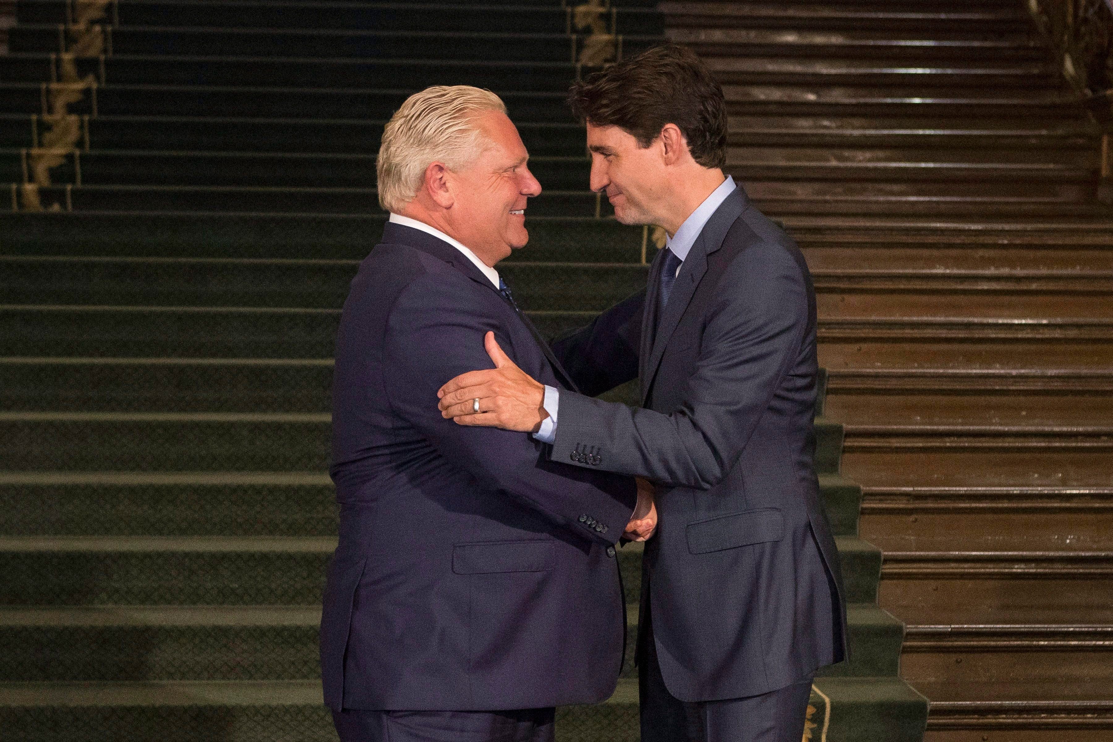 Doug Ford greets Justin Trudeau at the Ontario Legislature in Toronto on Thursday, July 5, 2018 (THE CANADIAN PRESS/Chris Young)