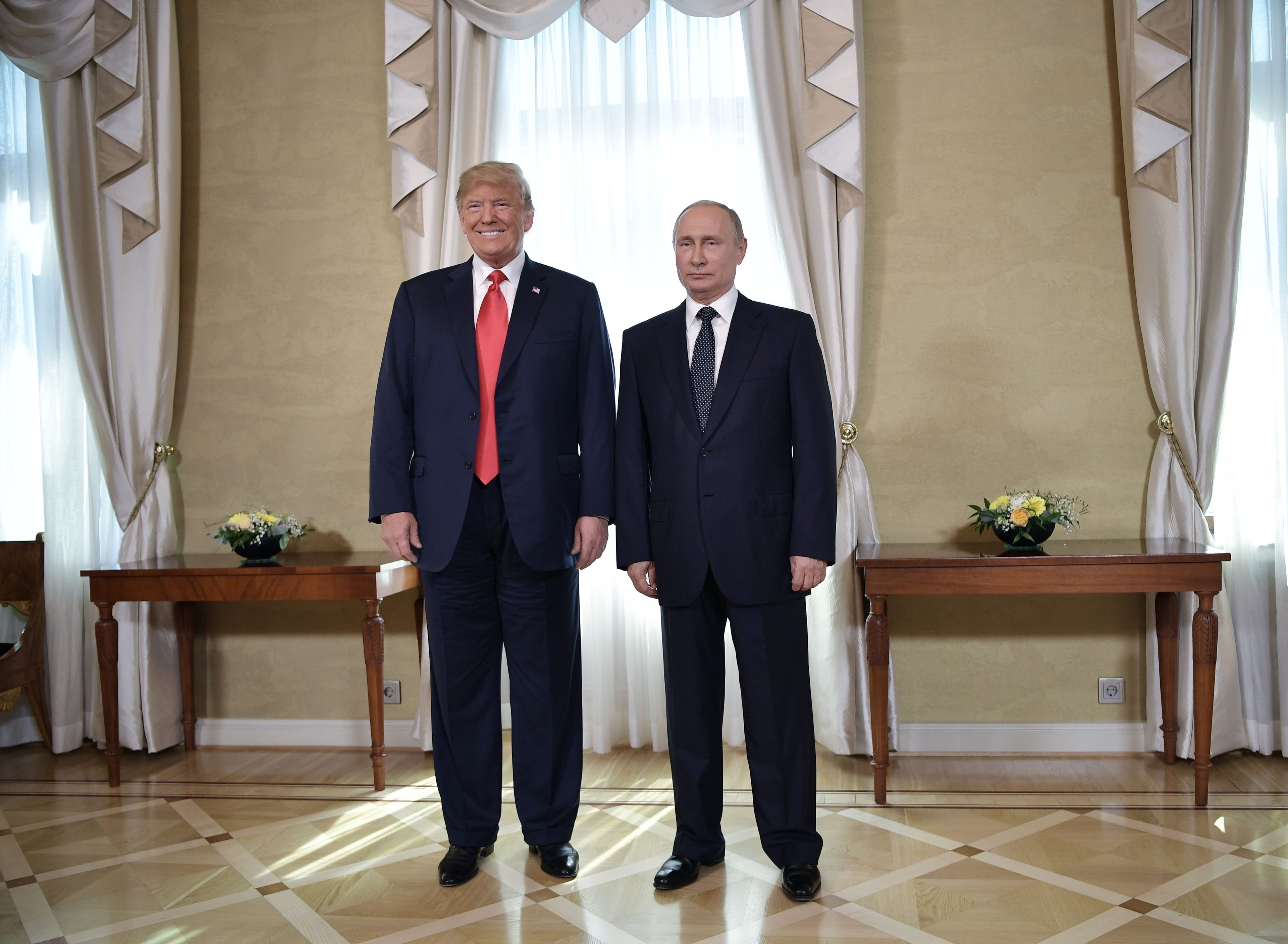 U.S. President Donald Trump and Russia's President Vladimir Putin pose ahead of their meeting in Helsinki, on July 16, 2018. (ALEXEY NIKOLSKY/AFP/Getty Images)