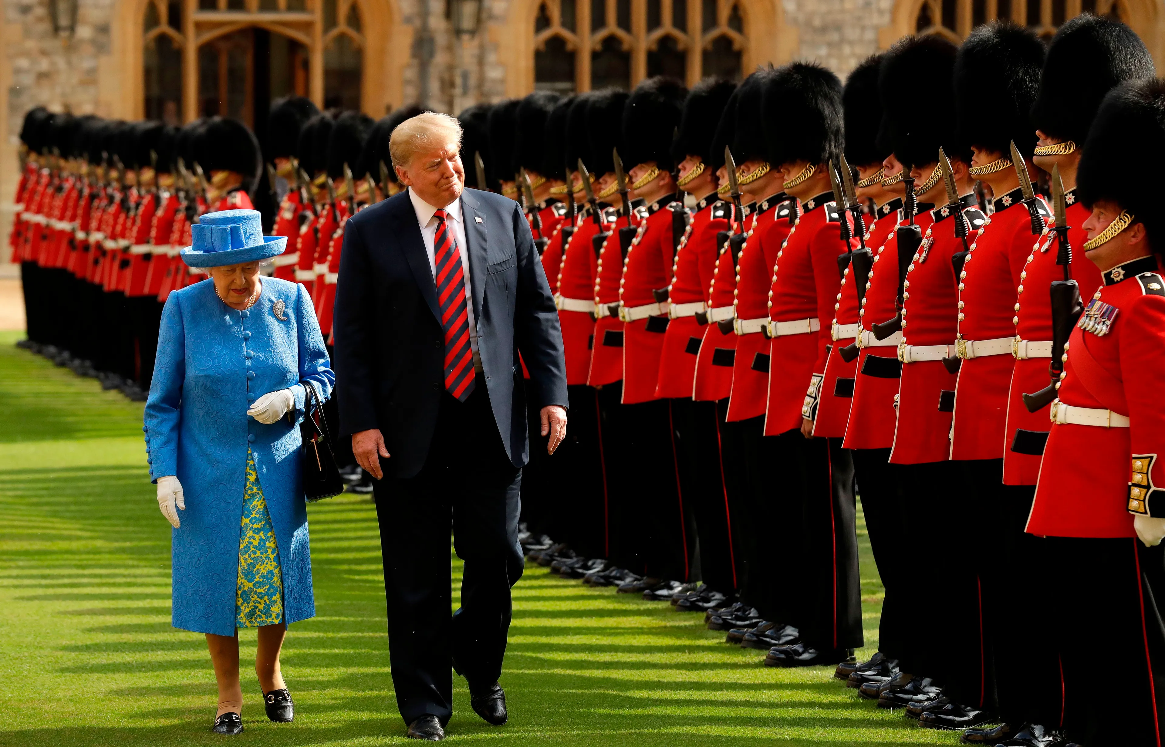 Britain's Queen Elizabeth II (L) and US President Donald Trump (R) inspect the guard of honour formed of the Coldstream Guards during a welcome ceremony at Windsor Castle in Windsor, west of London, on July 13, 2018 on the second day of Trump's UK visit. (Matt Dunham/AFP/Getty Images)