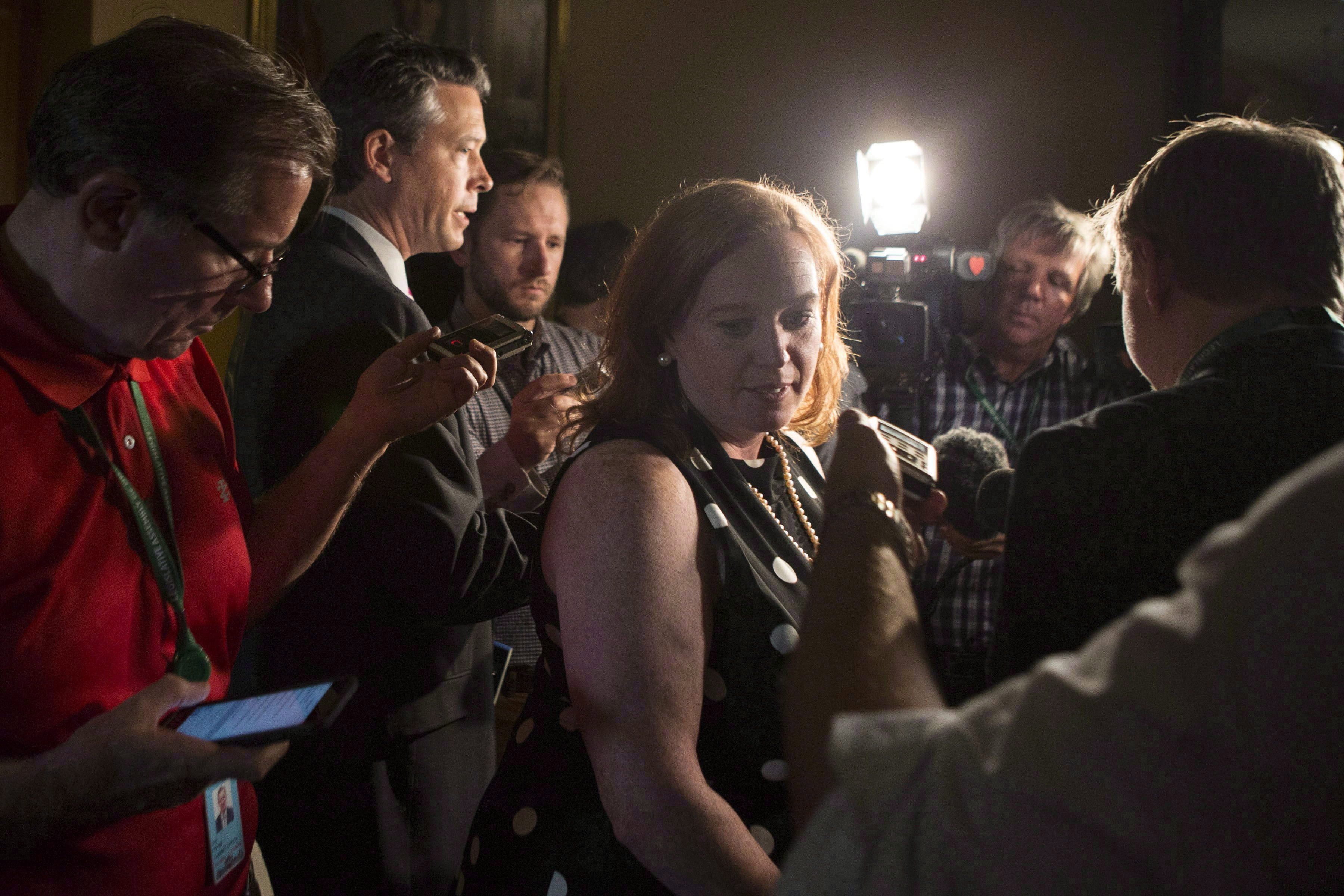 Ontario MPP Lisa Macleod turns away after scrumming with reporters at the Ontario Legislature, in Toronto on Thursday, July 5, 2018. A newly appointed Ontario minister demanded an apology after Federal Immigration Minister Ahmed Hussen said the province was promoting fear around asylum seekers. (Chris Young/CP)