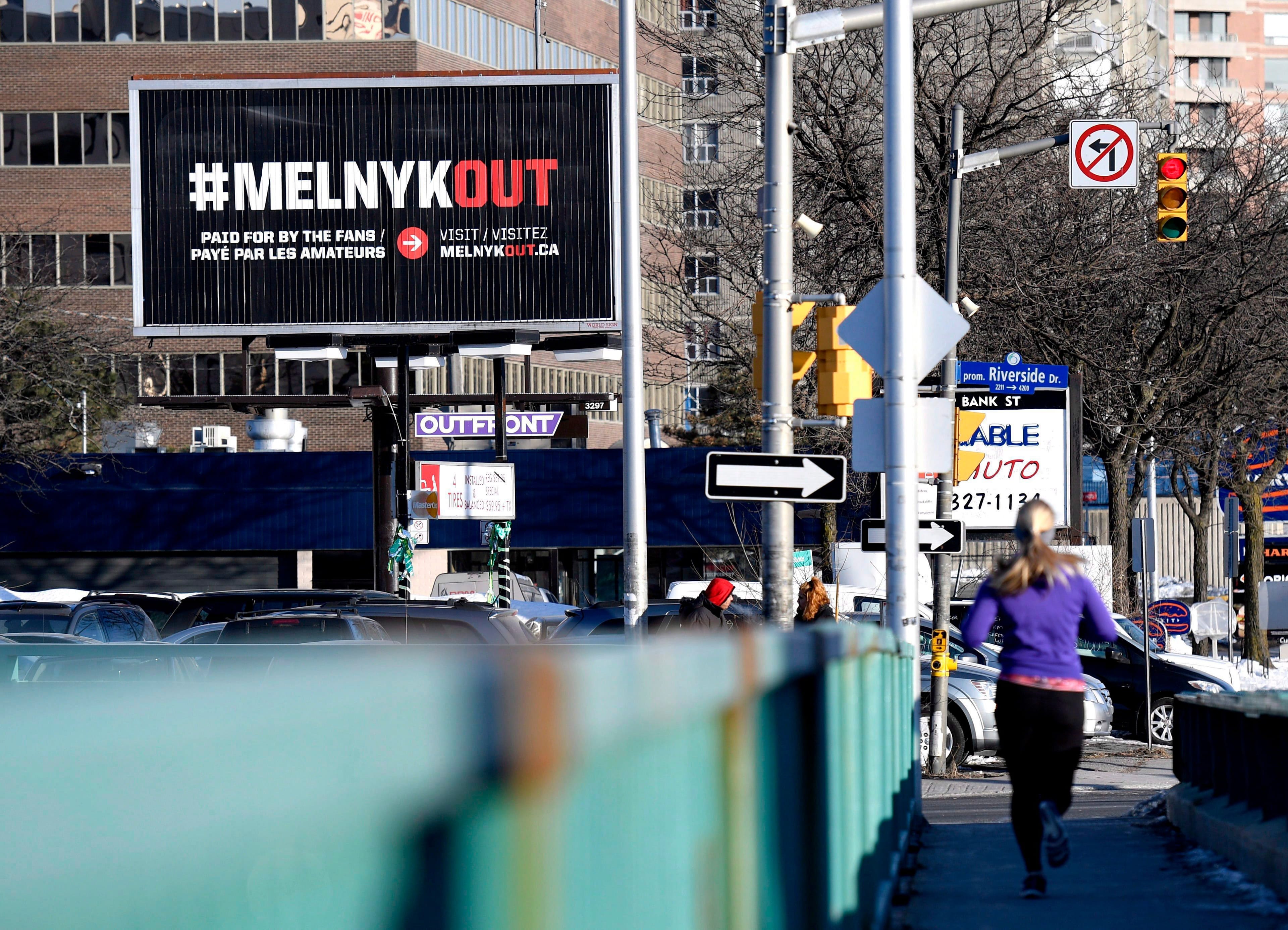 A billboard calling for Ottawa Senators owner Eugene Melnyk to sell the team is seen in Ottawa on Monday, March 19, 2018. (Justin Tang/CP)
