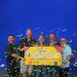 From left to right, Gilles Dionne, Stephane Dionne, , Bryan Redman, Christopher Beazley, and Norman MacDonald receving their $60-million cheque at the OLG prize centre in Toronto on July 19, 2018. (OLG)