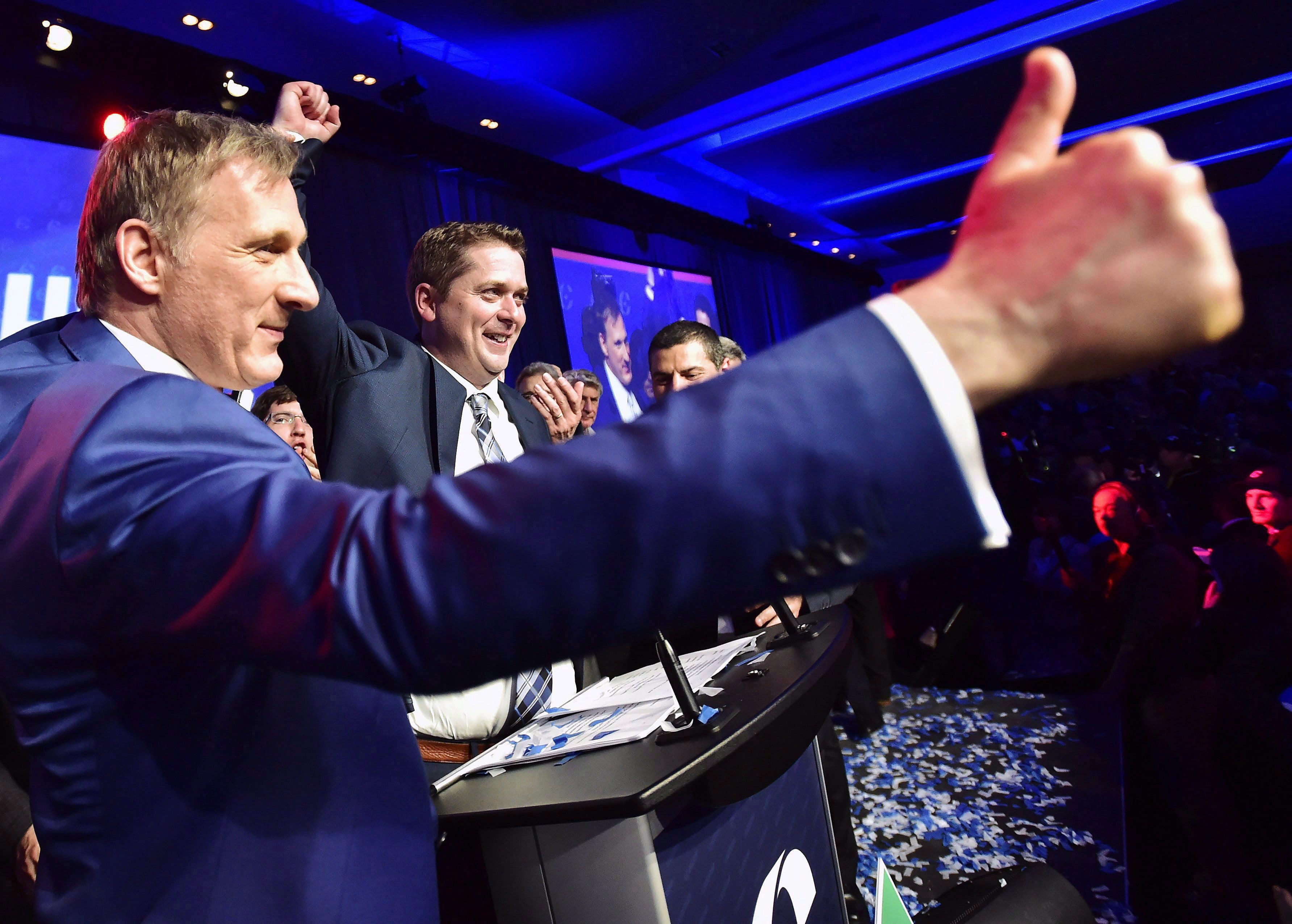 Bernier, left, congratulating Scheer after Scheer is elected leader in May 2017. THE CANADIAN PRESS/Frank Gunn