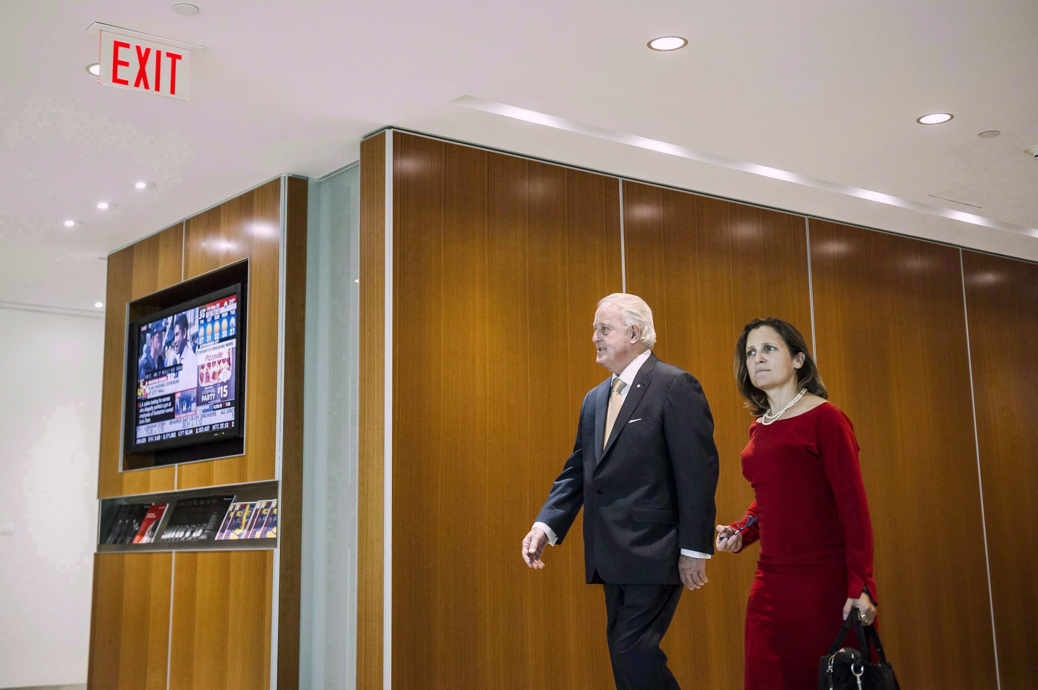 Minister of Foreign Affairs Chrystia Freeland meets former prime minister Brian Mulroney before a discussion with the original NAFTA negotiating team, in Toronto on Sept. 22, 2017. (THE CANADIAN PRESS/Christopher Katsarov)