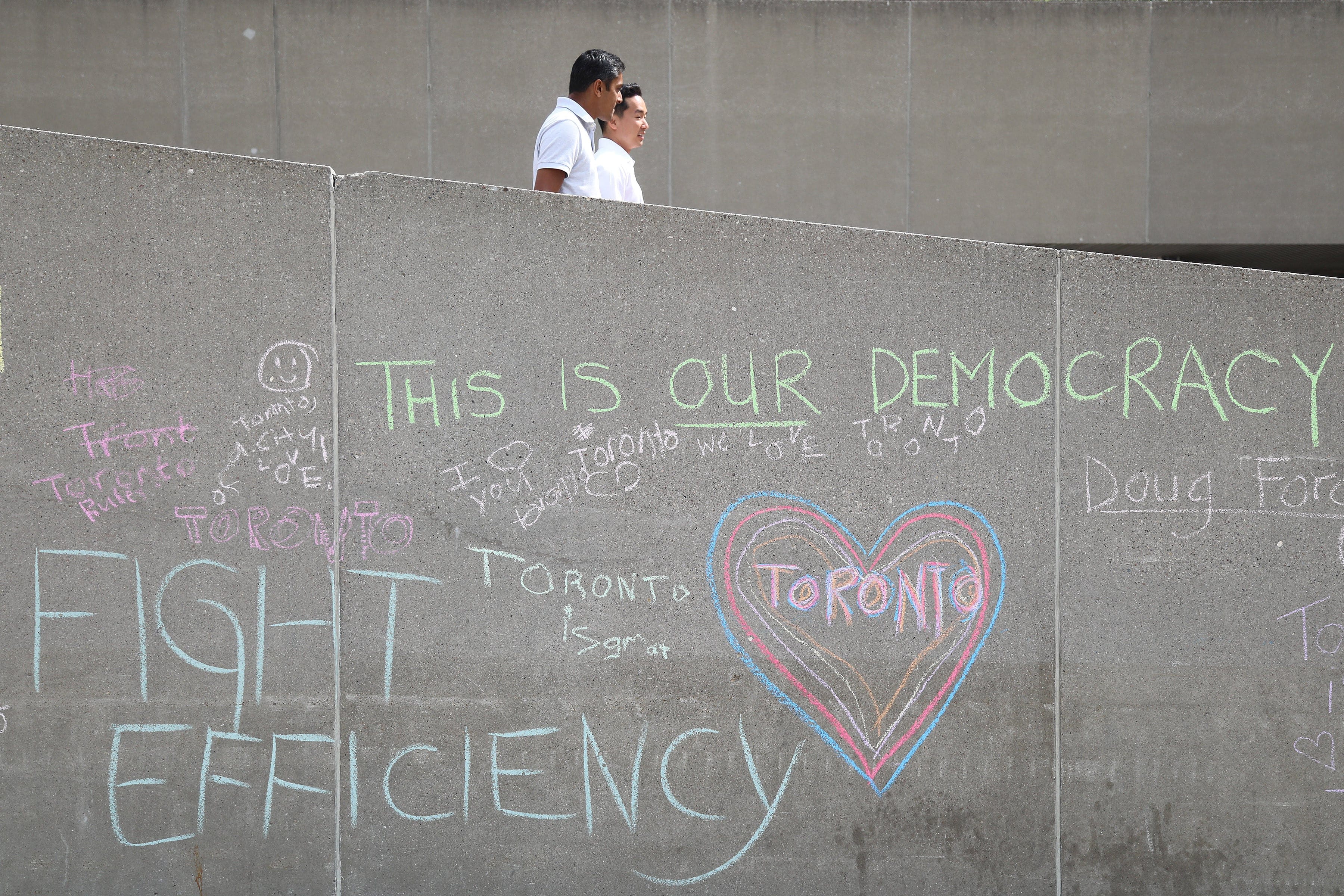 TORONTO, ON- Messages start on the walls of Nathan Phillips Square. Toronto city councillors debate Bill 5 at City Hall on Monday . August 20, 2018. (Rene Johnston/Toronto Star via Getty Images)