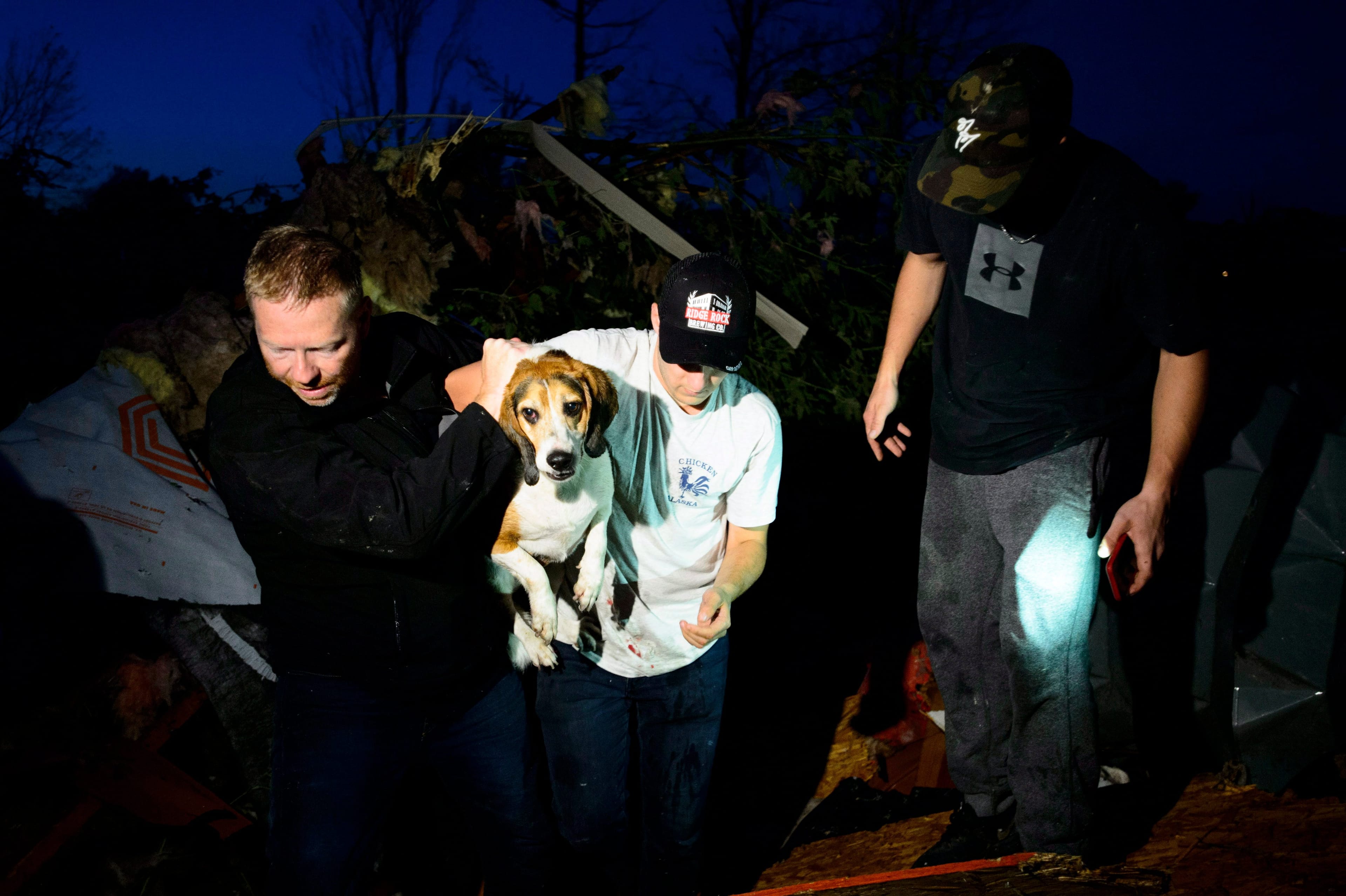 A dog named Charlie is rescued after being found under a pile of debris after a tornado touched down in Dunrobin, Ontario west of Ottawa on Friday, Sept. 21, 2018. (Sean Kilpatrick/CP)