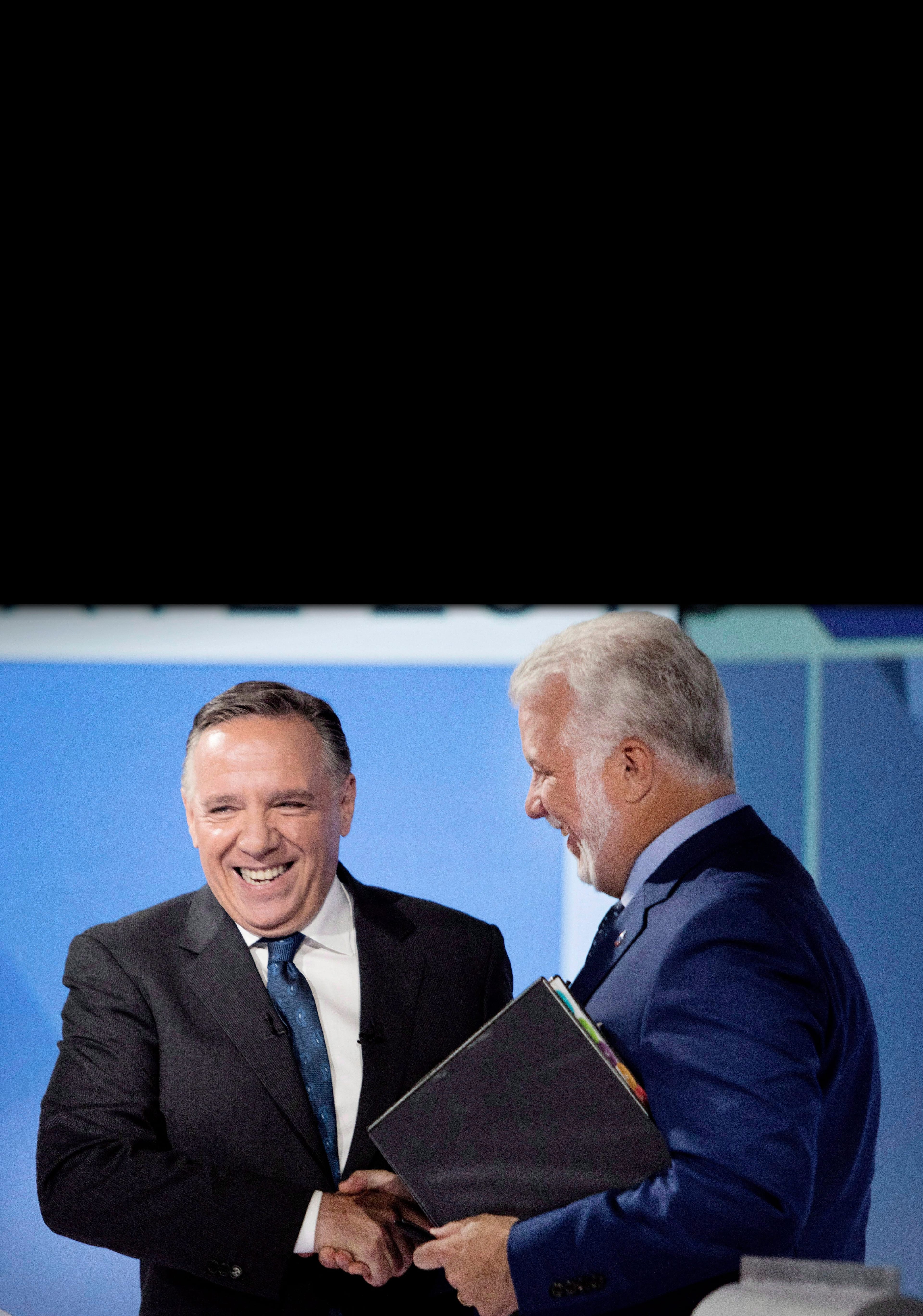 CAQ leader Francois Legault, left, shakes hands with Liberal Leader Philippe Couillard after their English language debate, Monday, September 17, 2018 in Montreal, Que. (Allan McInnis/CP)
