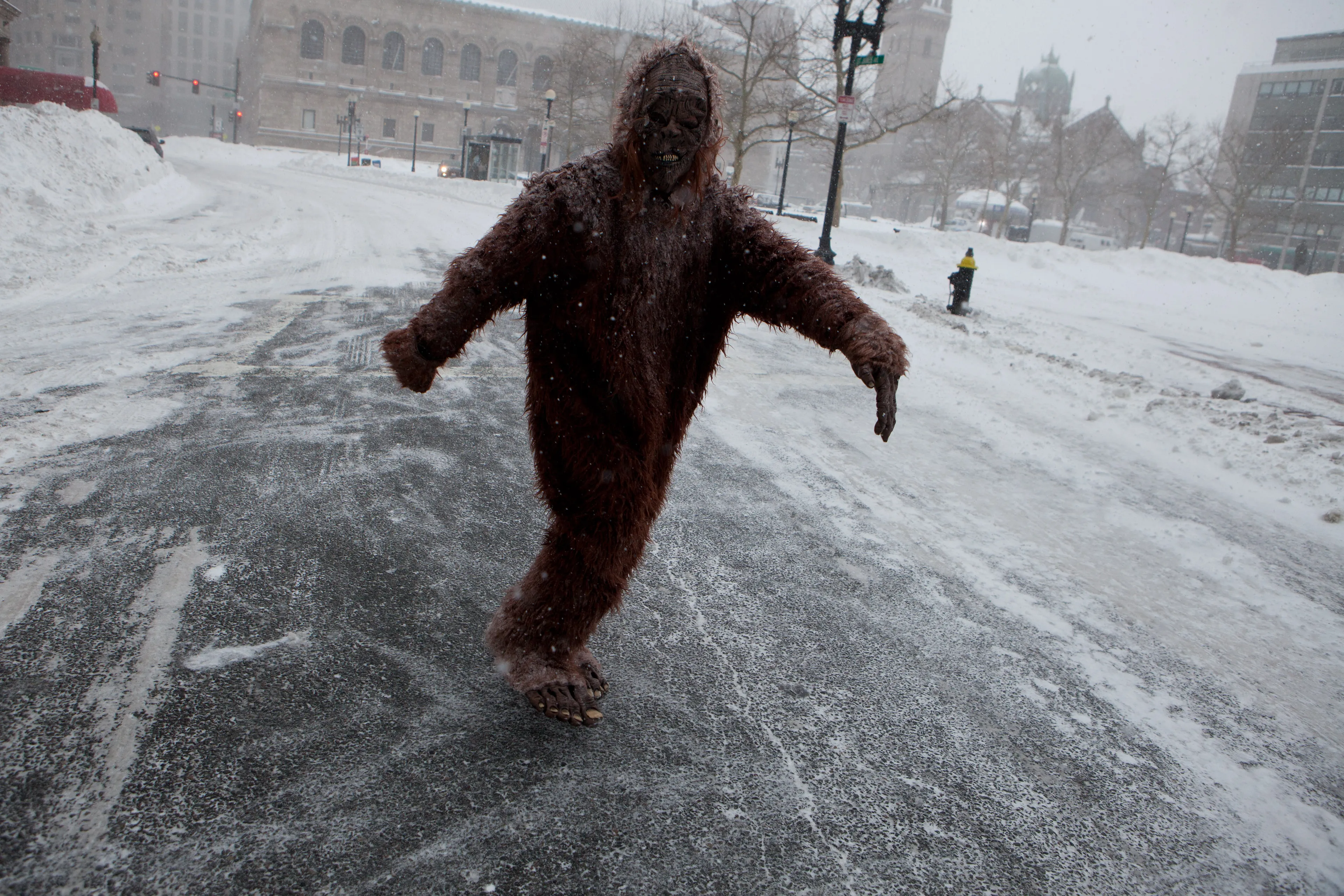 A pedestrian dressed as 'Bigfoot' makes their way through the strong wind and snow in the Back Bay neighbourhood during a blizzard on January 27, 2015 in Boston, Massachusetts. (Kayana Szymczak/Getty Images)