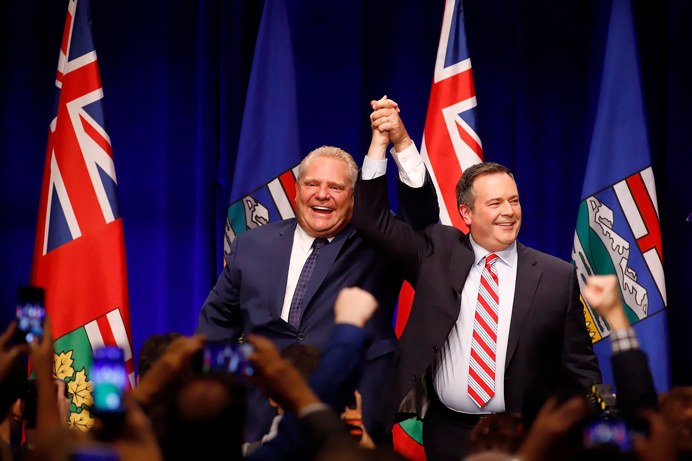 Kenney and Ford cheer with supporters at Friday's anti-carbon tax rally in Calgary THE CANADIAN PRESS/Jeff McIntosh