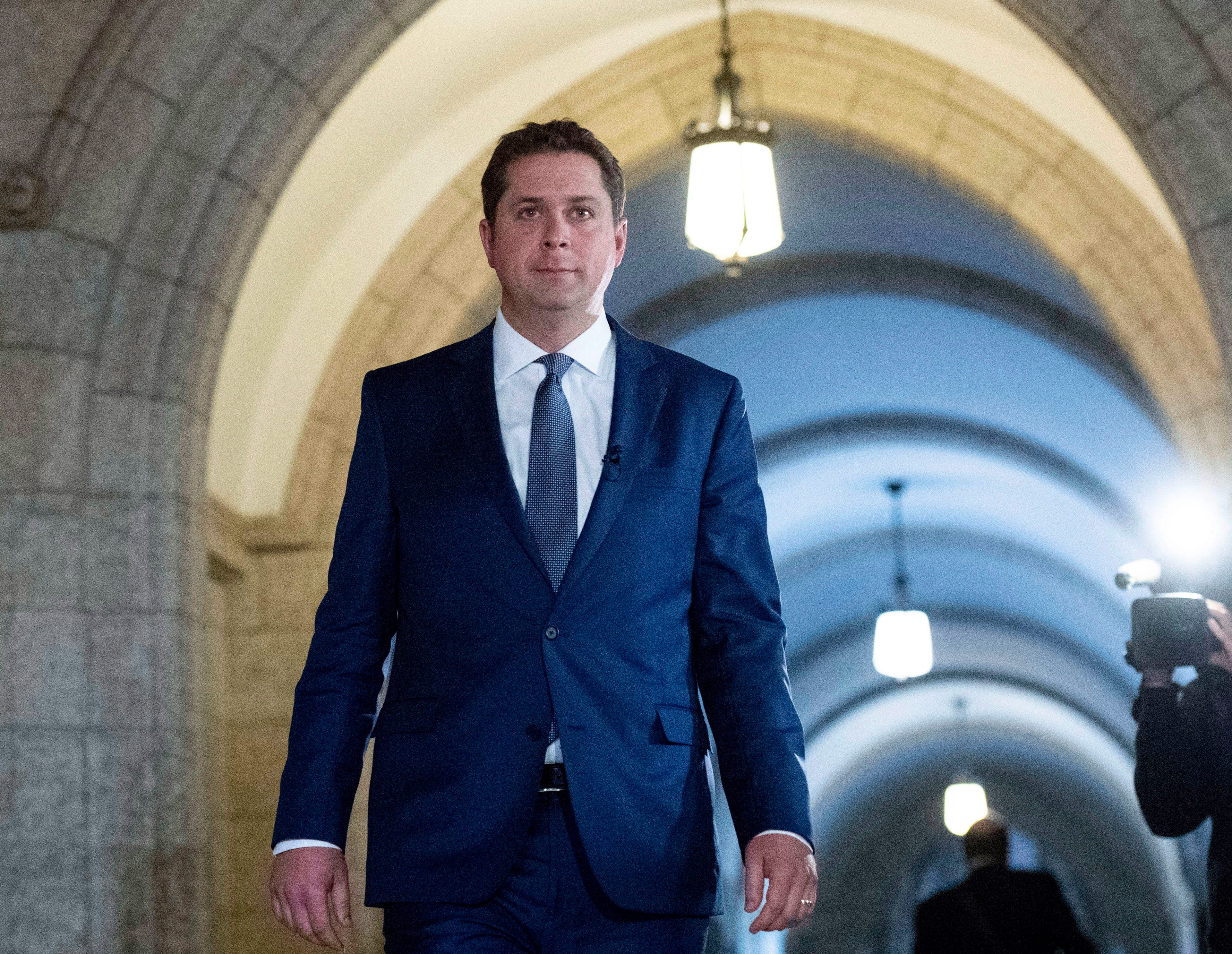 Conservative Leader Andrew Scheer makes his way to speak to media in response to the USMCA trade deal, in the foyer of the House of Commons on Parliament Hill, in Ottawa on Monday, Oct. 1, 2018. THE CANADIAN PRESS/Justin Tang