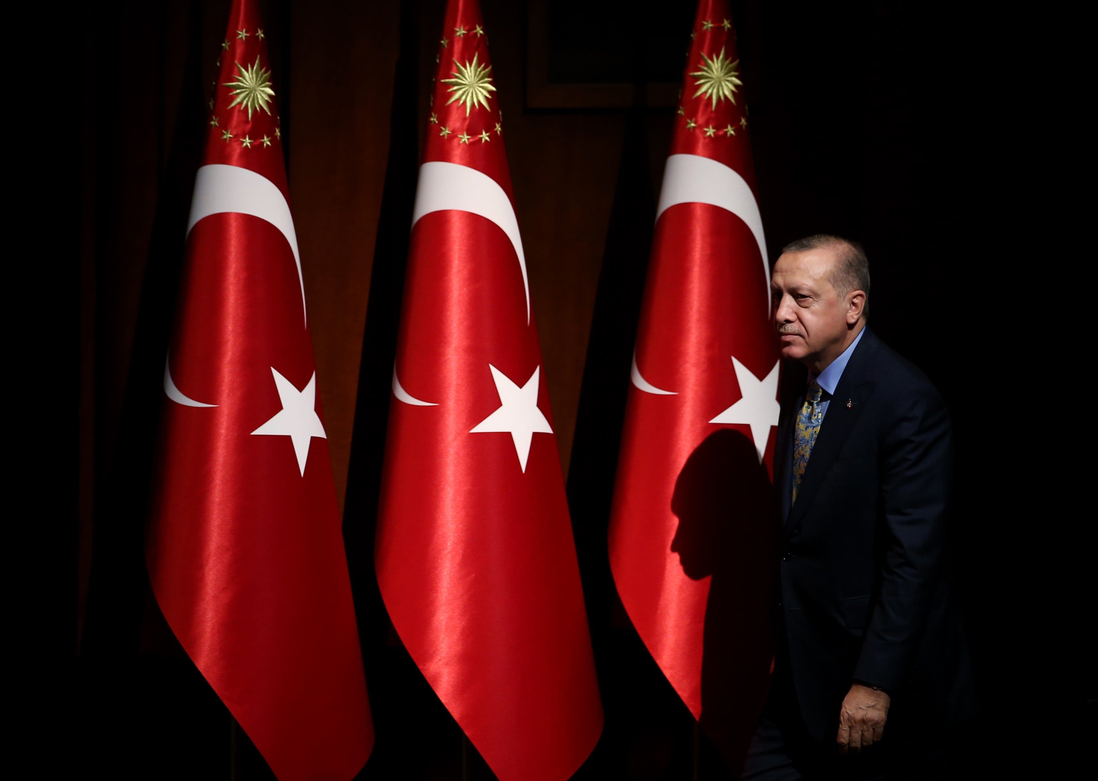 President of Turkey Recep Tayyip Erdogan greets the crowd during a meeting at Turkey's Bestepe National Congress and Culture Center on Oct. 23, 2018. (Rasit Aydogan/Anadolu Agency/Getty Images)