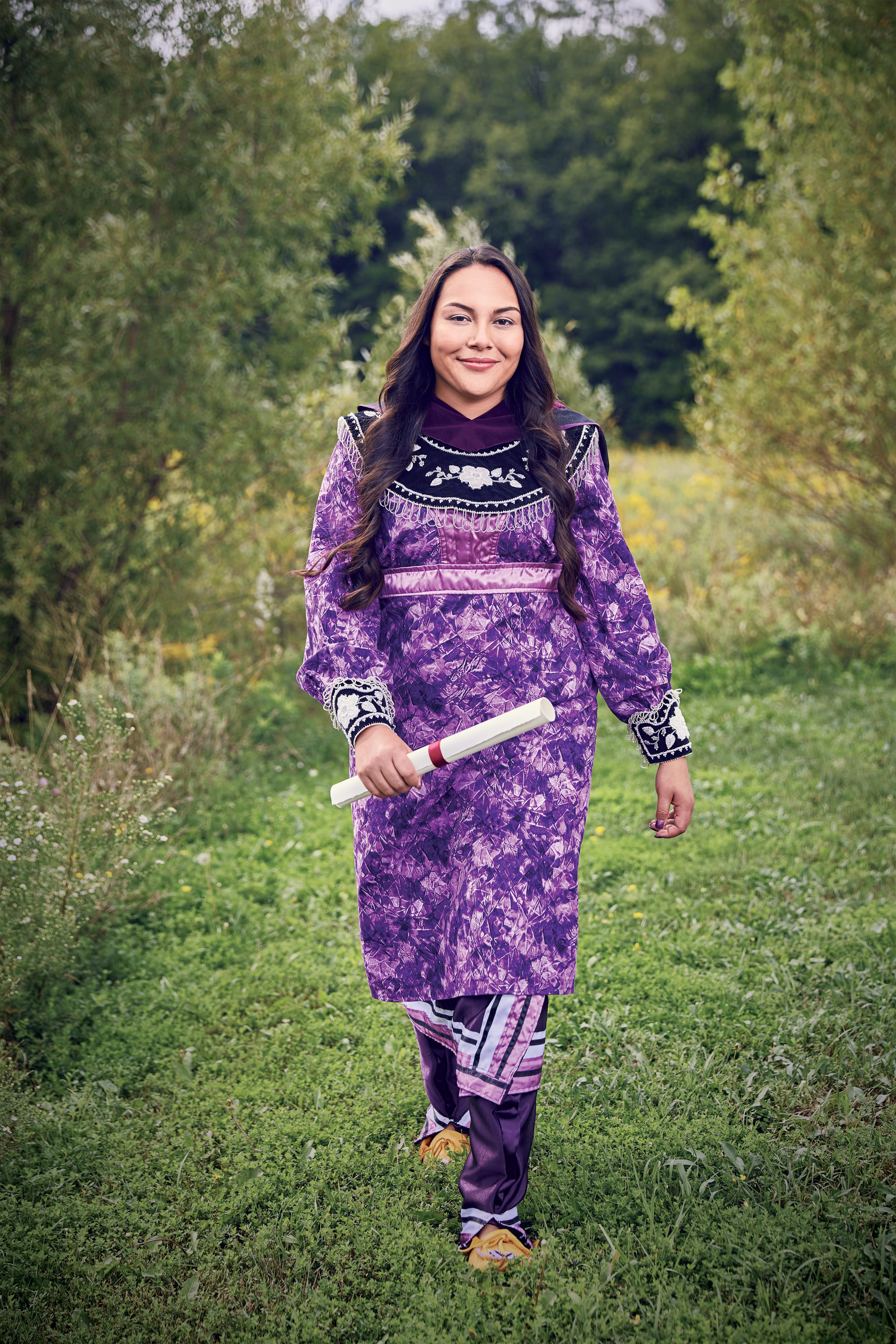 Katsitsionhawi Hill outside her Six Nations Polytechnic campus (Photograph by KC Armstrong; Dress by Karohiaroroks Phyllis Hill; Beaded collar and cuffs by Yvonne Thomas; Hair and makeup by Aniko Tar/Judy Inc.)
