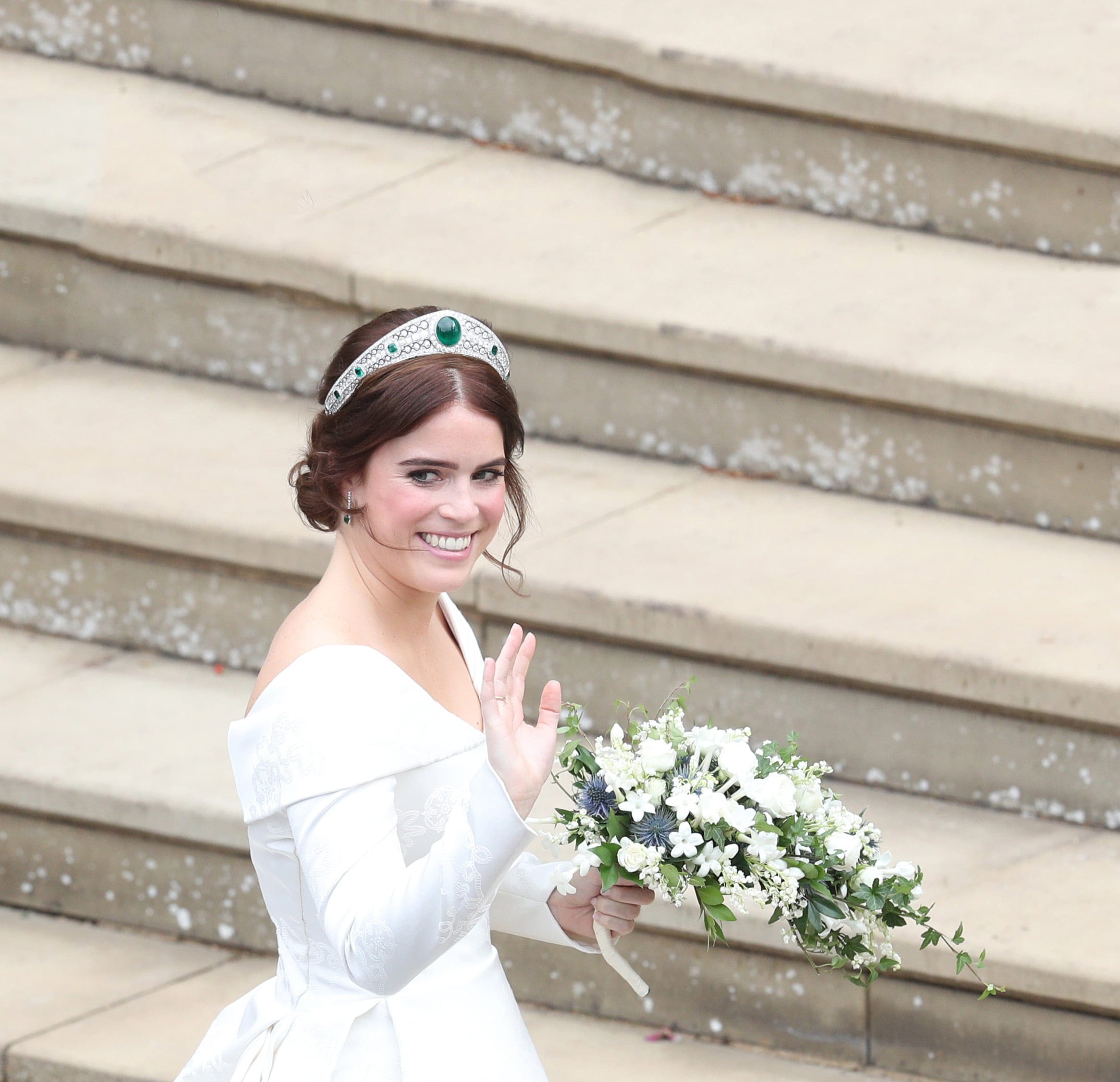 Britain's Princess Eugenie of York waves as she arrives for her wedding to Jack Brooksbank at St George's Chapel, Windsor Castle, in Windsor, on October 12, 2018. (Andrew Matthews/AFP/Getty Images)