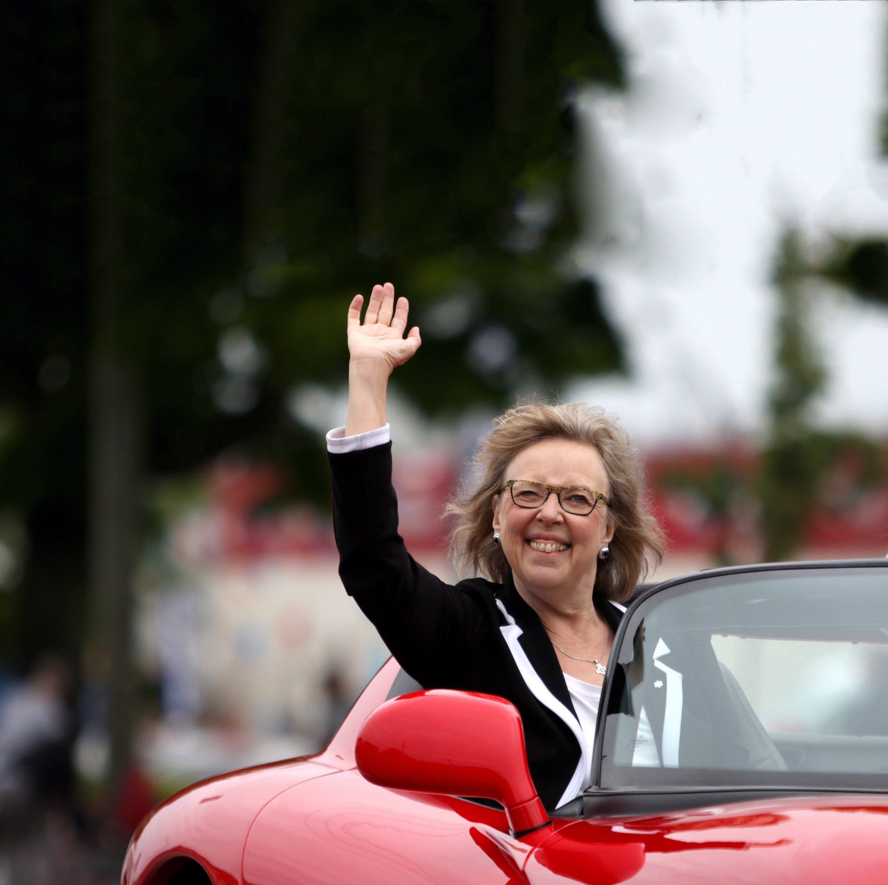 Green Party Leader Elizabeth May waves to the crowd as she rides in a sports car along Douglas St. during the annual Victoria Day Parade in Victoria, B.C., on Monday, May 21, 2018. (Chad Hipolito/CP)