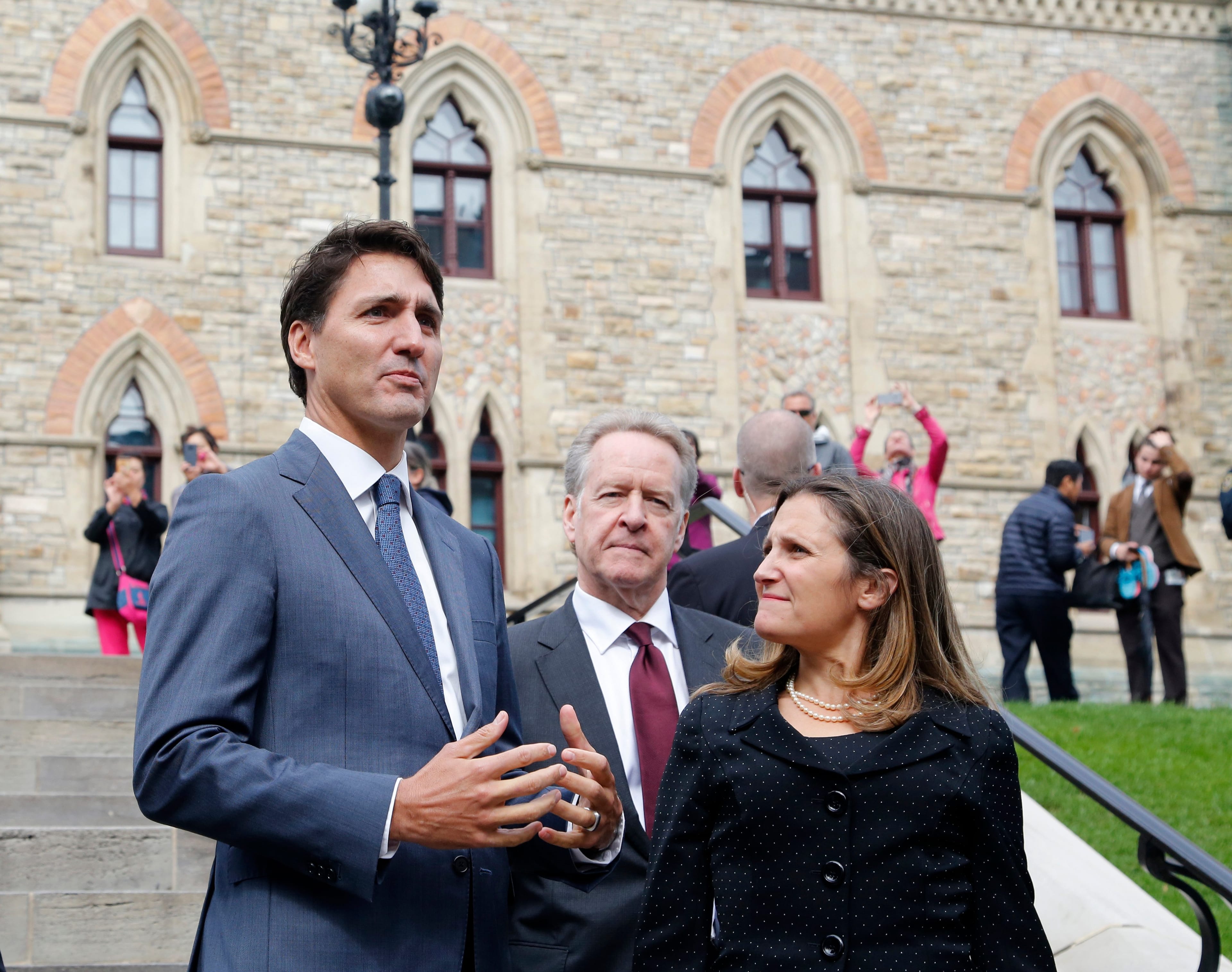 Prime Minister Justin Trudeau, Canada's chief trade negotiator Steve Verheul and Minister of Foreign Affairs Chrystia Freeland walk to a press conference to announce the new USMCA trade pact in Ottawa, Oct. 1, 2018. (PATRICK DOYLE/AFP/Getty Images)