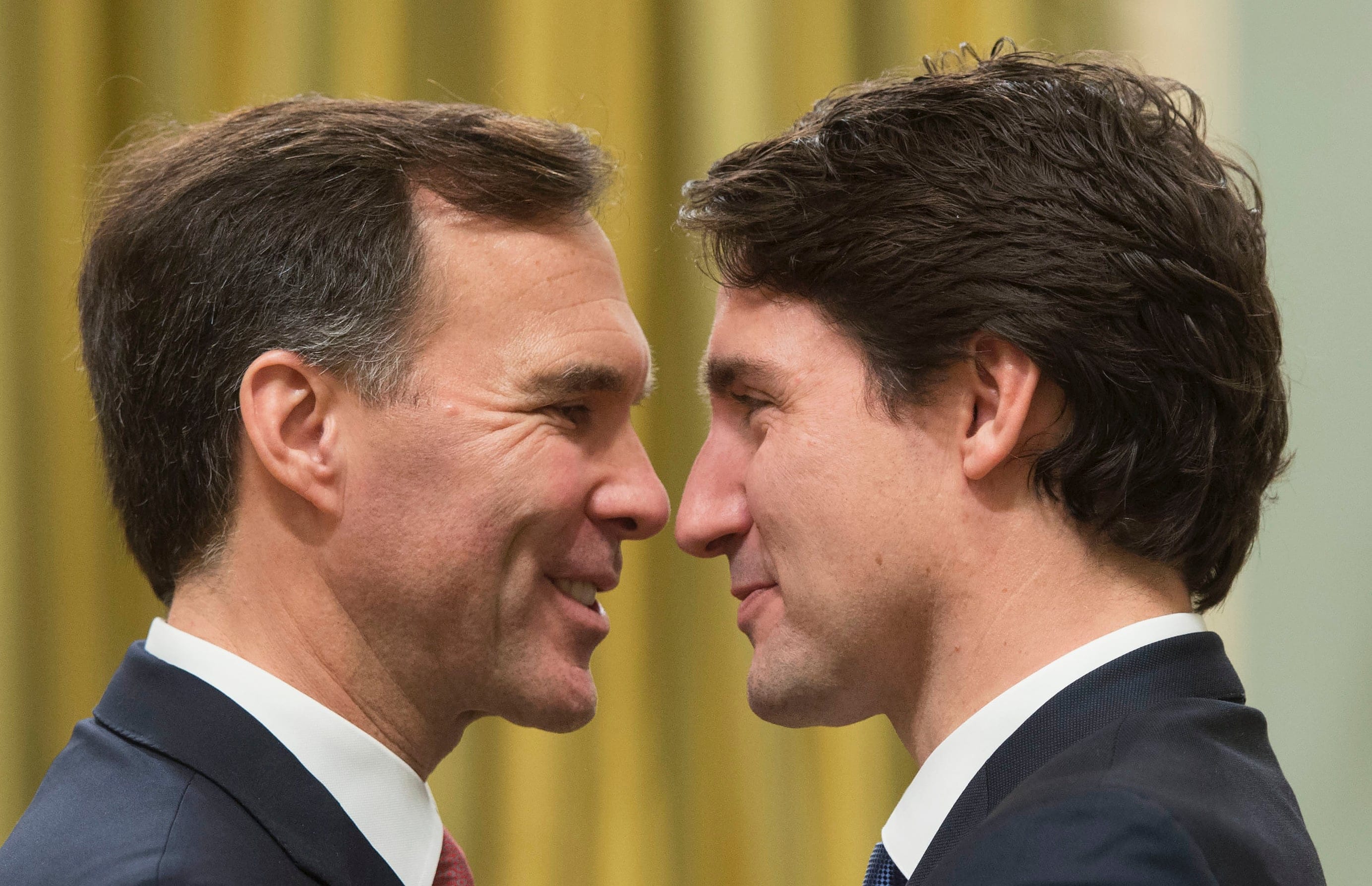 Prime Minister Justin Trudeau speaks with Finance Minister Bill Morneau at Rideau Hall in Ottawa on Nov. 4, 2015. (ADRIAN WYLD,MIGUEL MEDINA,SEAN KILPATRICK/AFP/Getty Images)