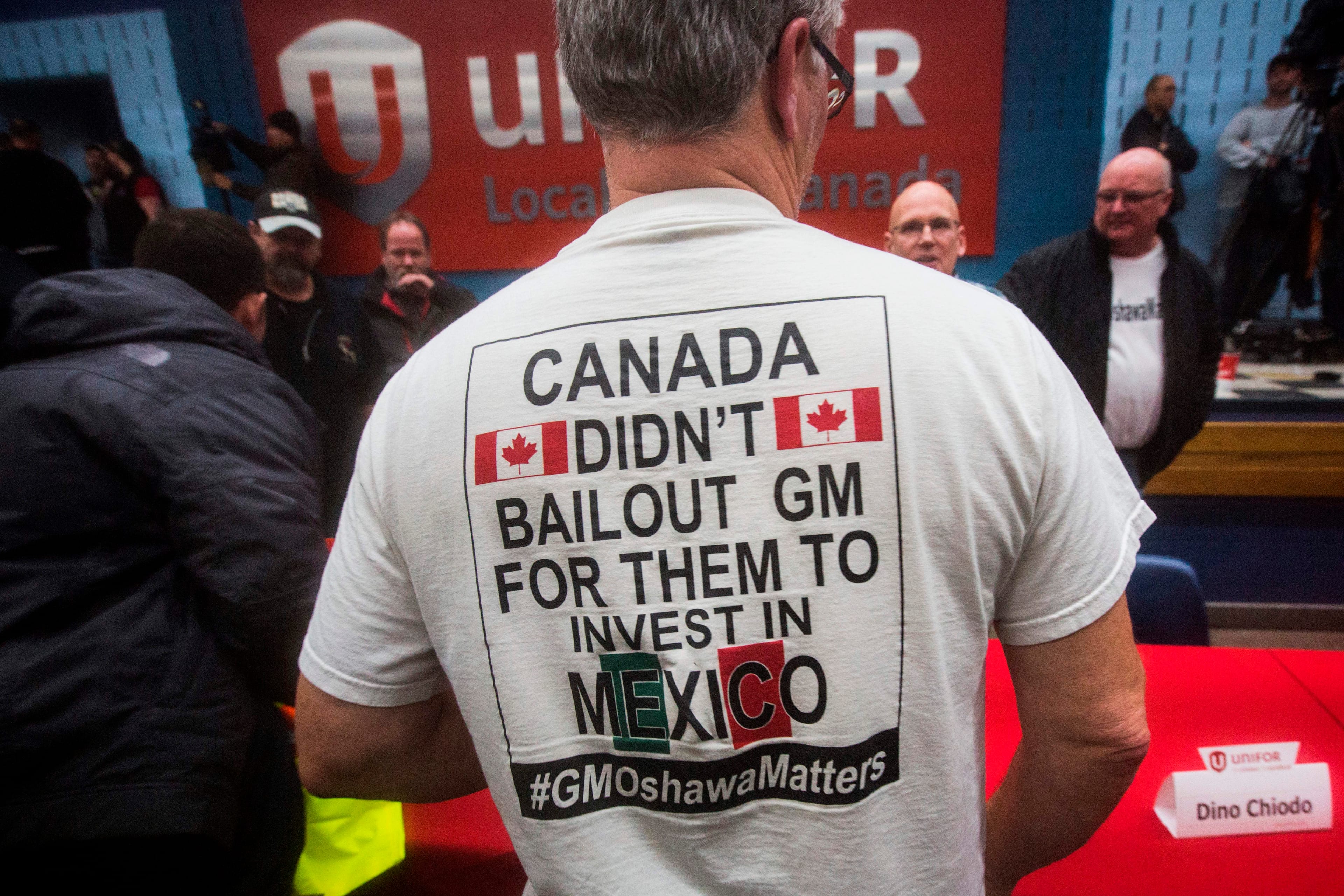 A t-shirt says it all at an autoworkers' union meeting held in Oshawa, Ont. after GM's announcement (Lars Hagberg/AFP/Getty Images)