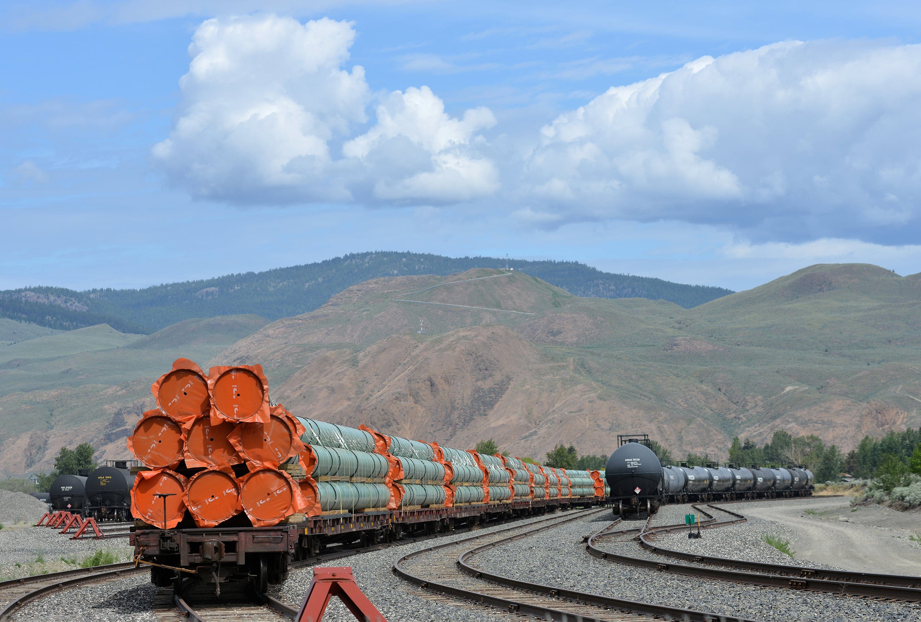 Steel pipe to be used in the construction of the Trans Mountain expansion project sit on rail cars in Kamloops, B.C. (Dennis Owen/Reuters)