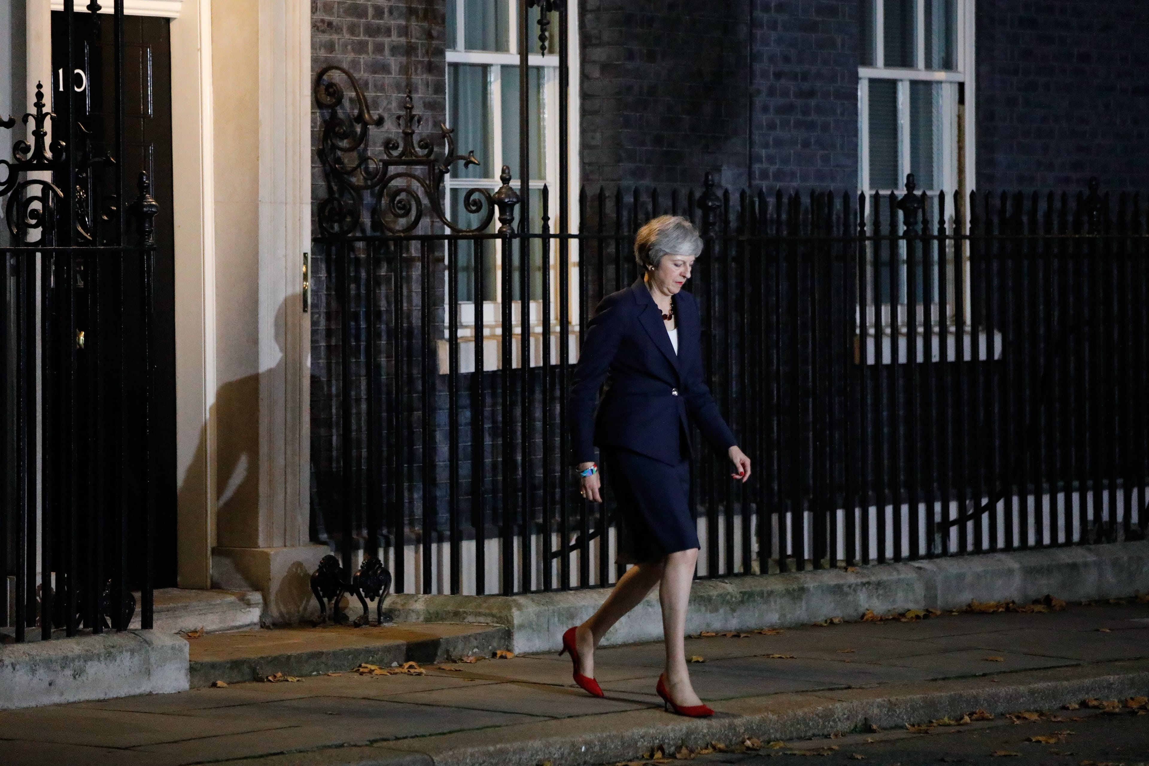 Britain's Prime Minister Theresa May comes out to give a statement outside 10 Downing Street in London on November 14, 2018, after holding a cabinet meeting where ministers were expected to either back the draft bexit deal or quit. - British Prime Minister Theresa May defended her anguished draft divorce deal with the European Union on Wednesday before rowdy lawmakers and a splintered cabinet that threatens to fall apart. (Photo by Tolga AKMEN / AFP) (Photo credit should read TOLGA AKMEN/AFP/Getty Images)