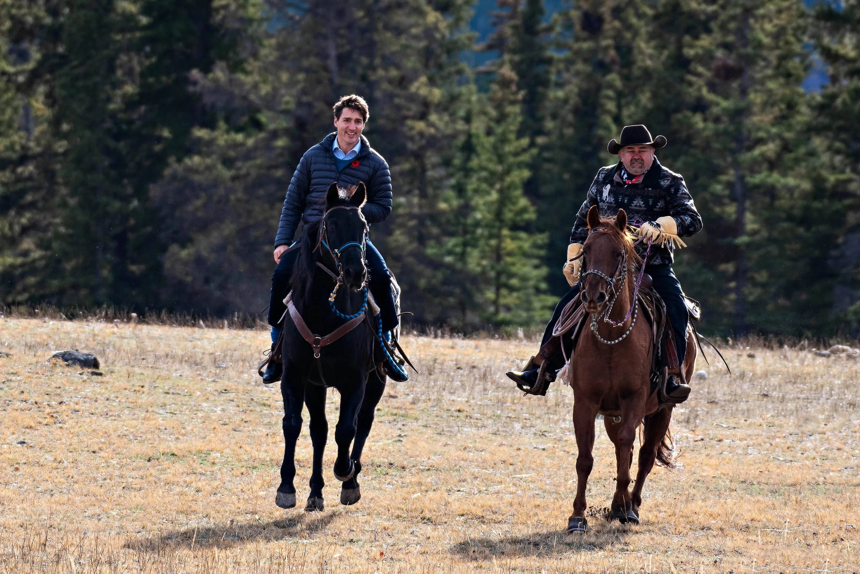 Prime Minister Justin Trudeau and Chief Joe Alphonse of the Tsilhqot’in national government ride in on Nov. 2, 2018. (Robyn Louise Photography)