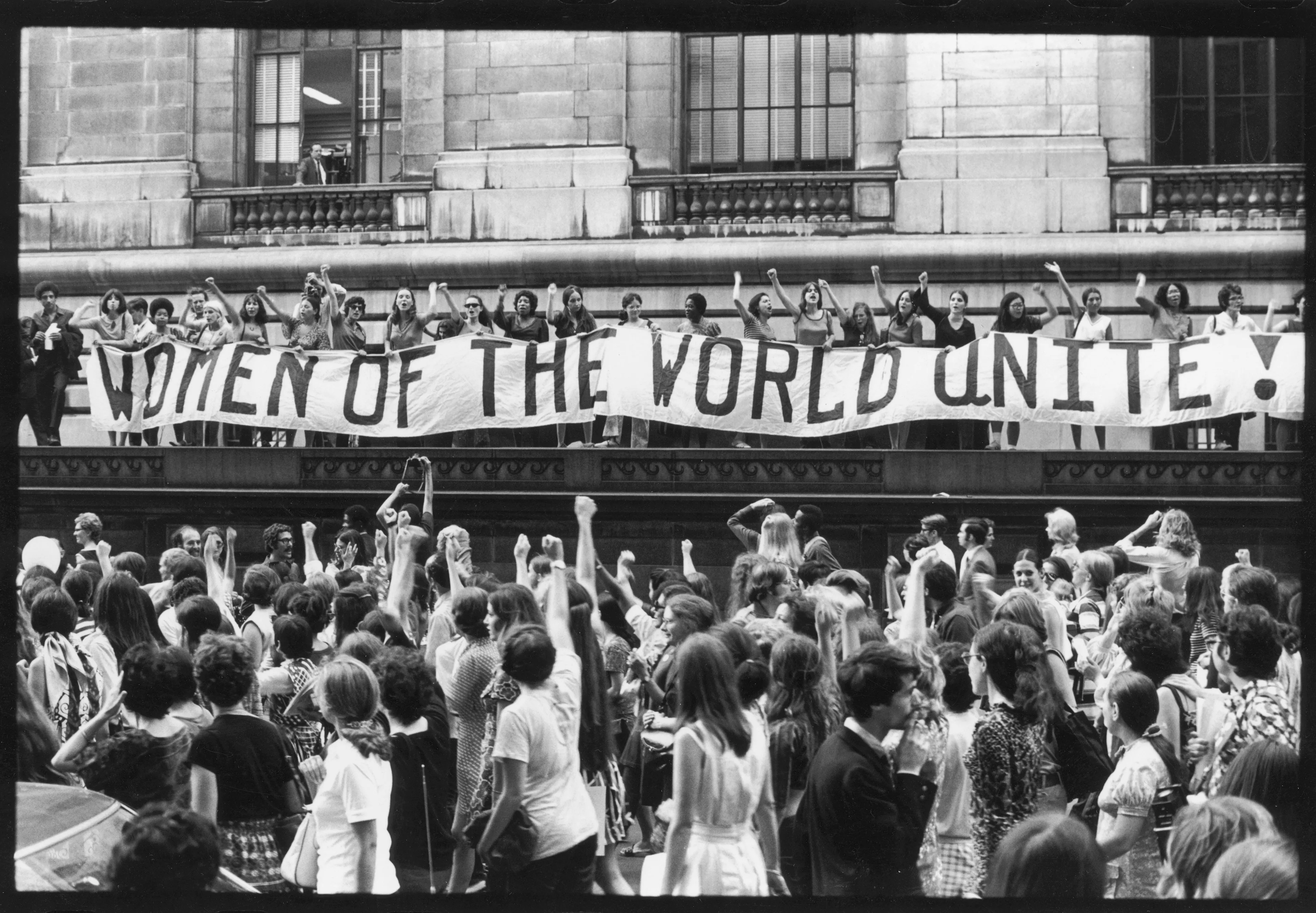 To commemorate the 50th anniversary of Women's Suffrage in the U.S., women march along 5th Avenue, past a banner that reads "Women of the World Unite!," New York, NY, Aug. 26, 1970. (Fred W. McDarrah/Getty Images)