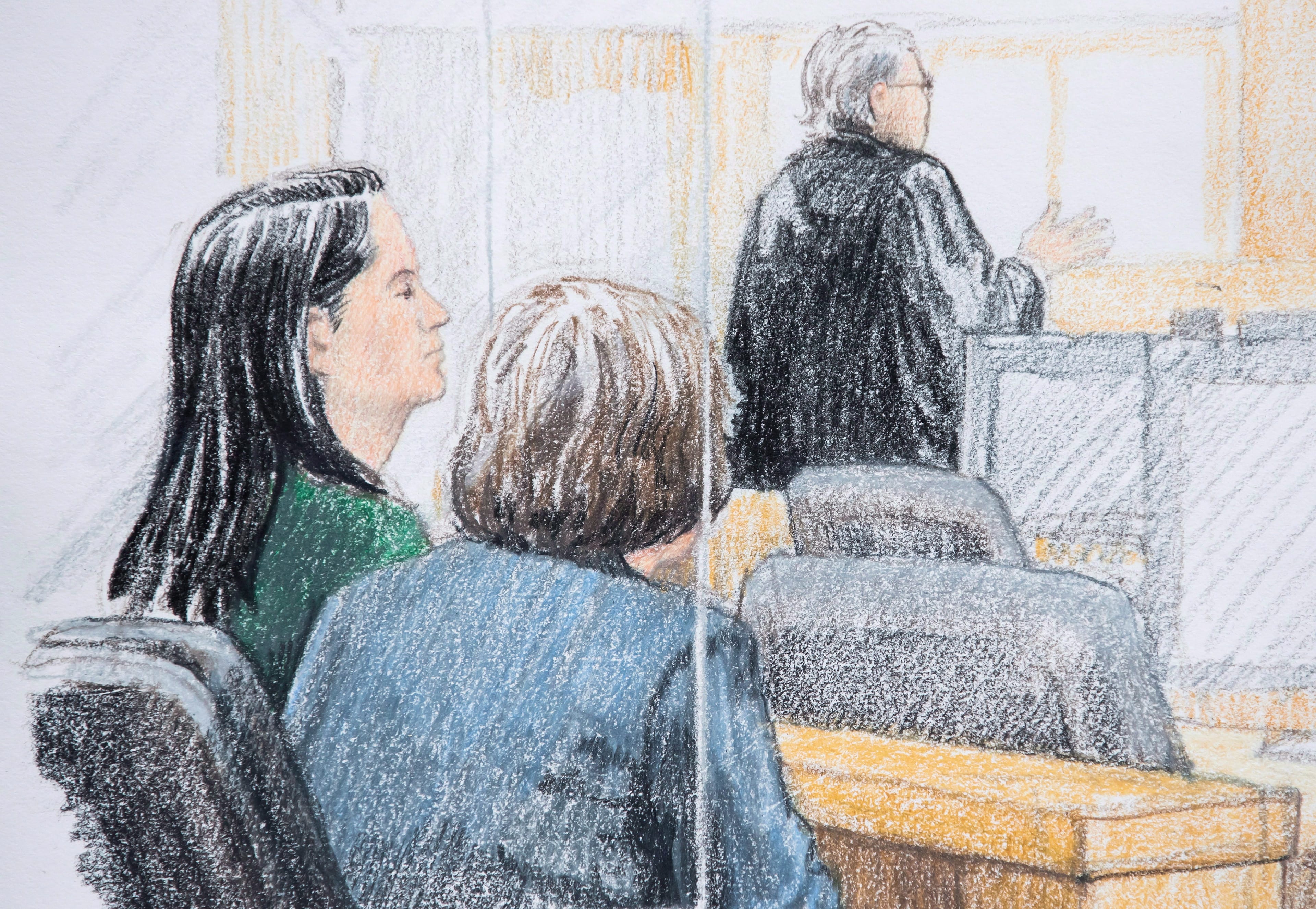 In this courtroom sketch, Meng Wanzhou, the chief financial officer of Huawei Technologies, sits beside a translator during a bail hearing at B.C. Supreme Court in Vancouver on Dec. 7, 2018. (THE CANADIAN PRESS/Jane Wolsak)