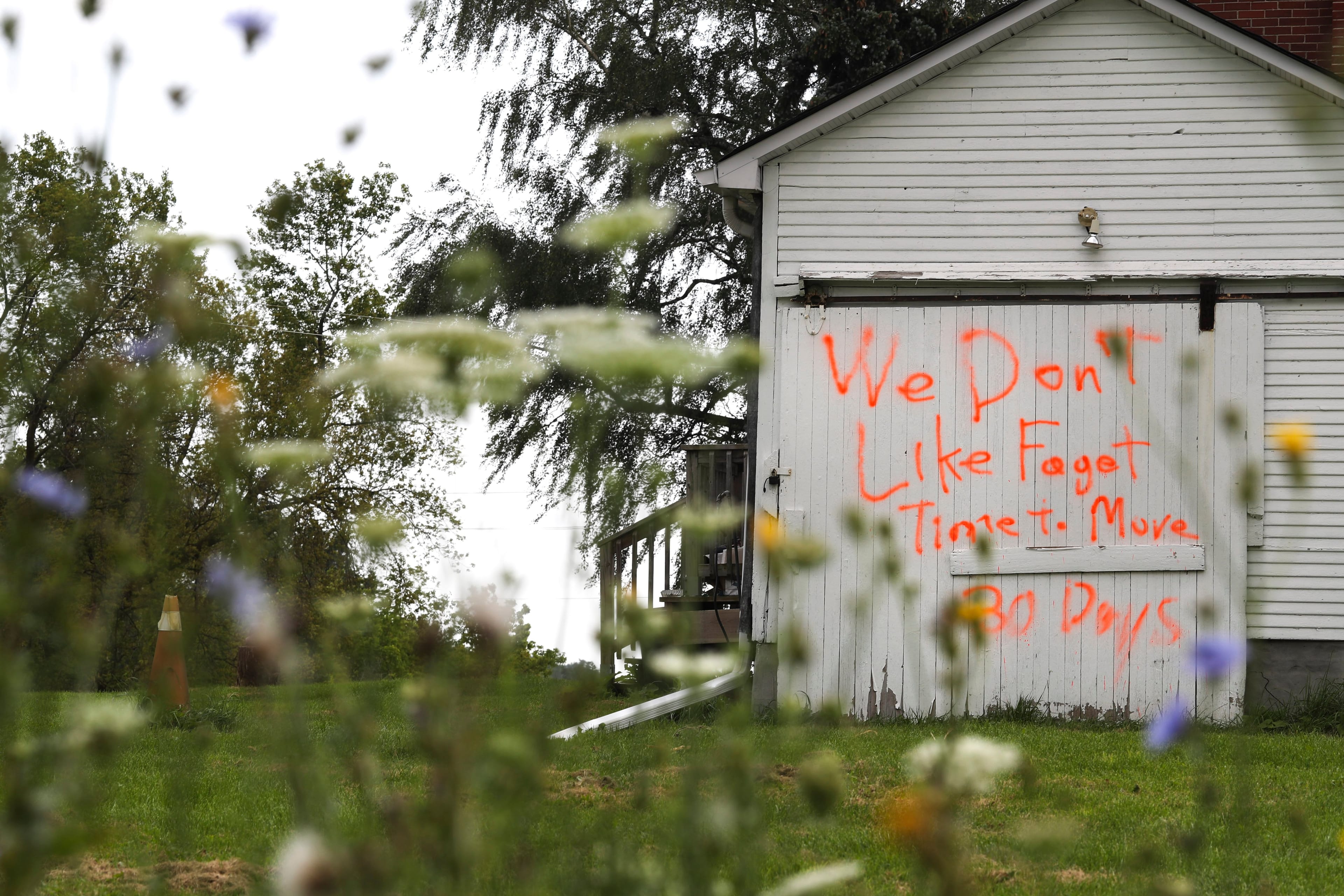 Hateful anti-gay graffiti on a garage in north Pickering, Ont. Southern Ontario cities saw a marked rise in reported hate crimes in 2017 (Richard Lautens/Toronto Star/Getty Images)