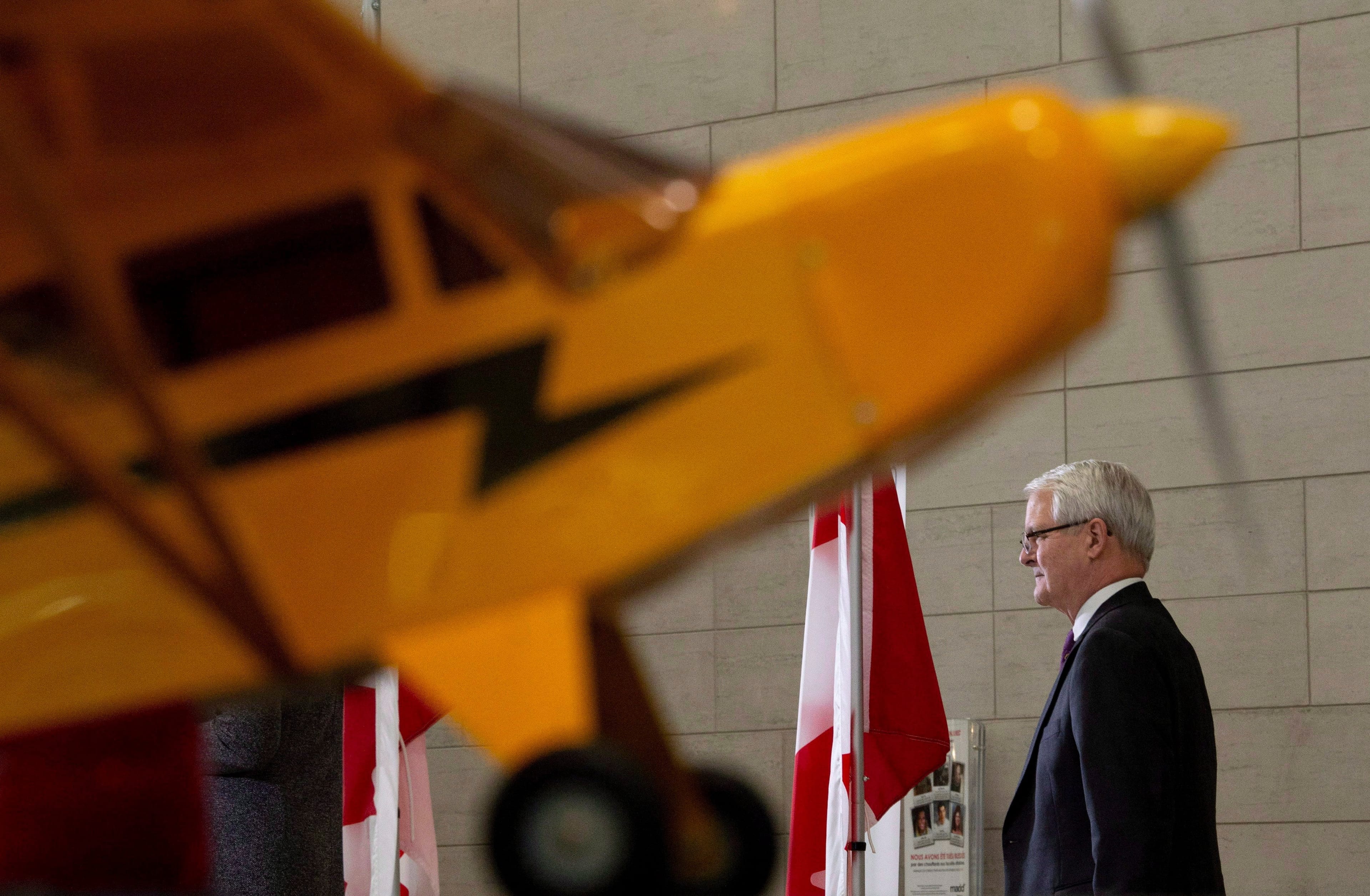 Transport Minister Marc Garneau waits to speak about passenger rights during a news conference at the airport in Ottawa, Monday December 17, 2018. THE CANADIAN PRESS/Adrian Wyld