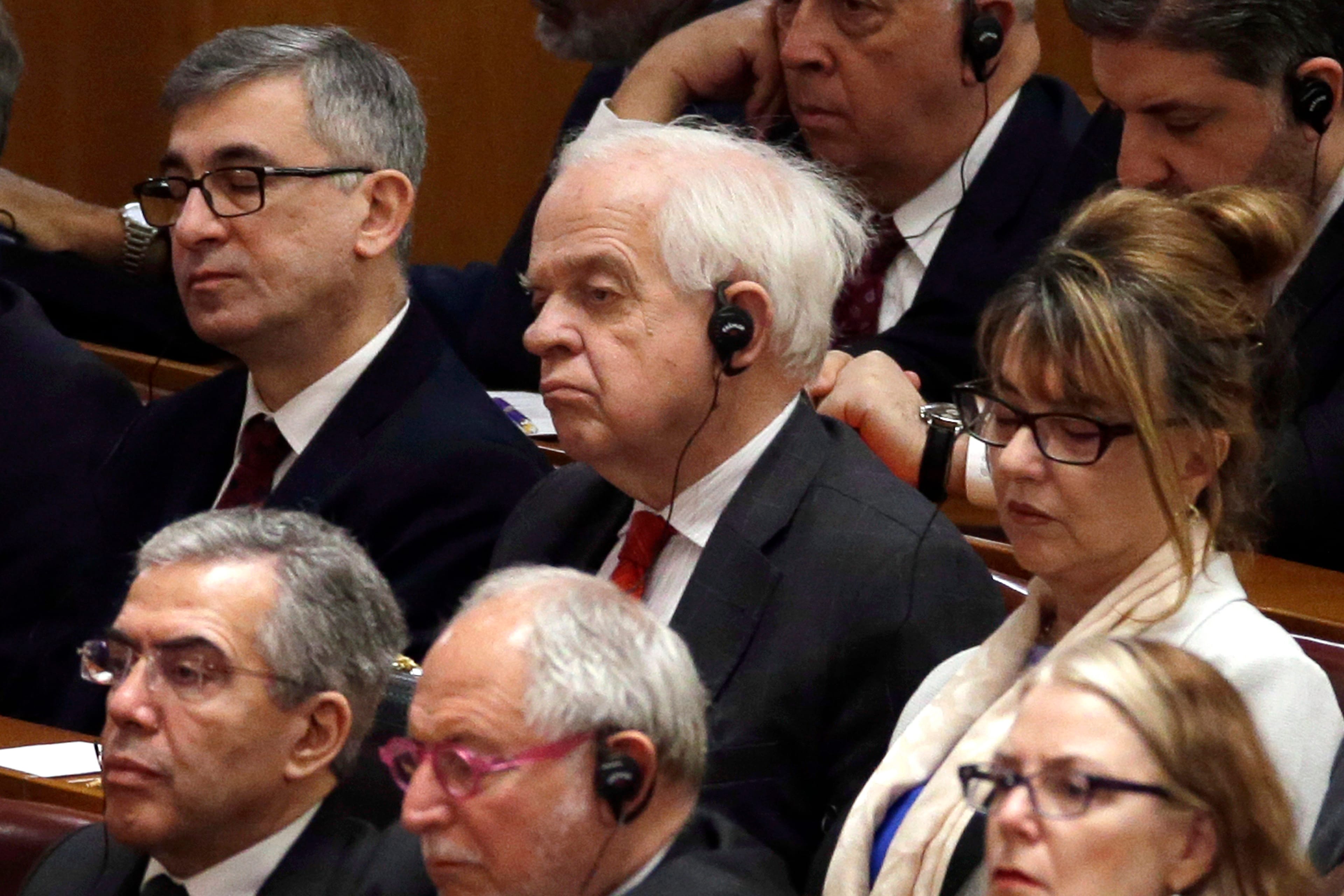 McCallum attends a conference to commemorate the 40th anniversary of China's Reform and Opening Up policy at the Great Hall of the People in Beijing, Tuesday, Dec. 18, 2018. (AP Photo/Mark Schiefelbein)