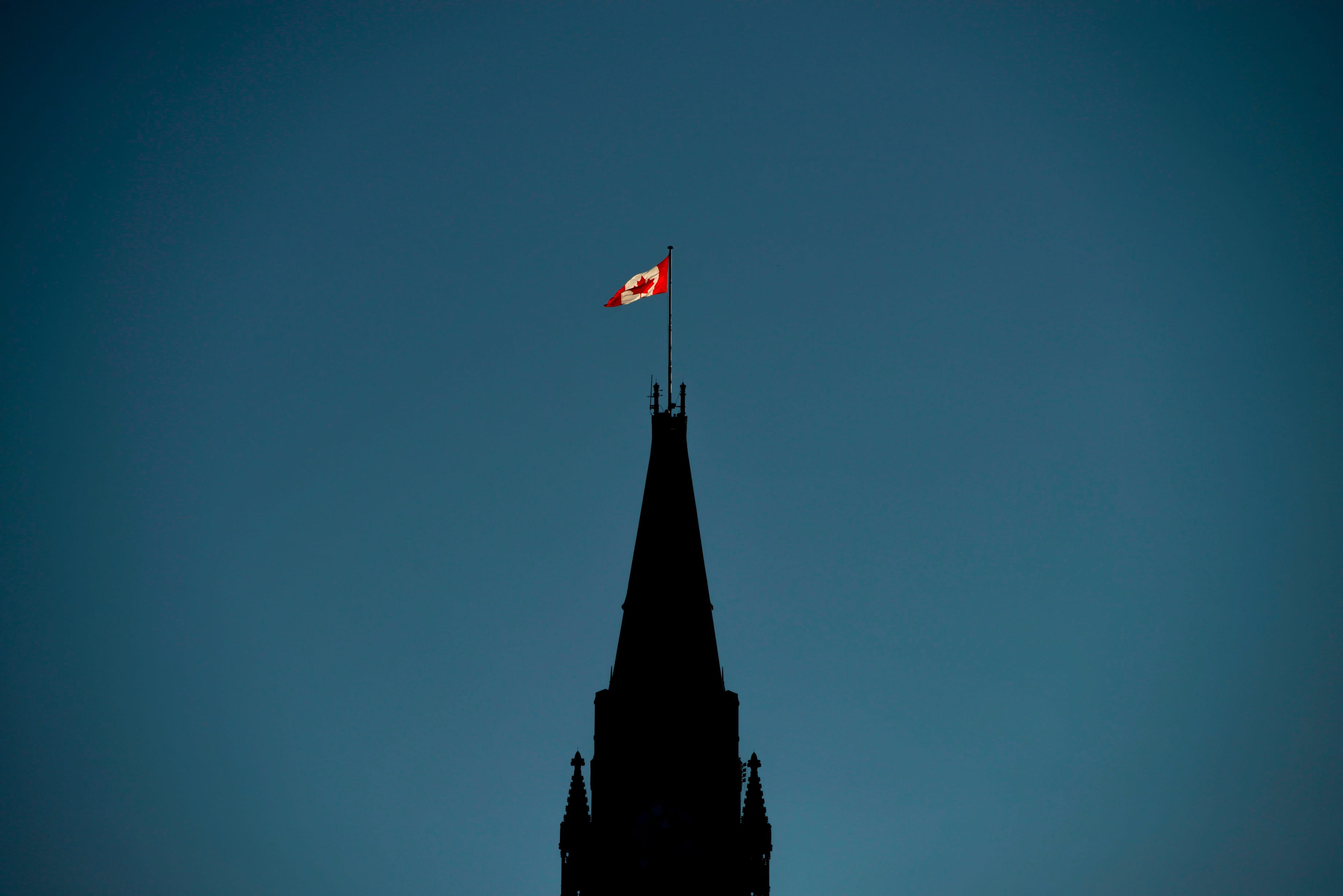 The Canadian Flag is illuminated by morning light atop the Peace Tower on Parliament Hill in Ottawa on Monday, Sept. 17, 2018. Parliamentarians return to the House of Commons today following the summer break. THE CANADIAN PRESS/Sean Kilpatrick